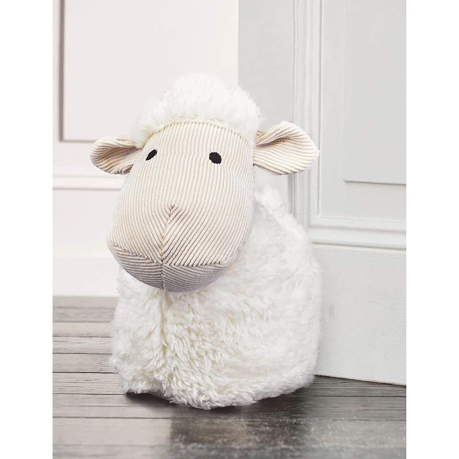 A plush white sheep toy with soft, fuzzy fur and black eyes. The toy has a round body, a long, fluffy tail, and a few small, soft, white … - The Magic Toy Shop