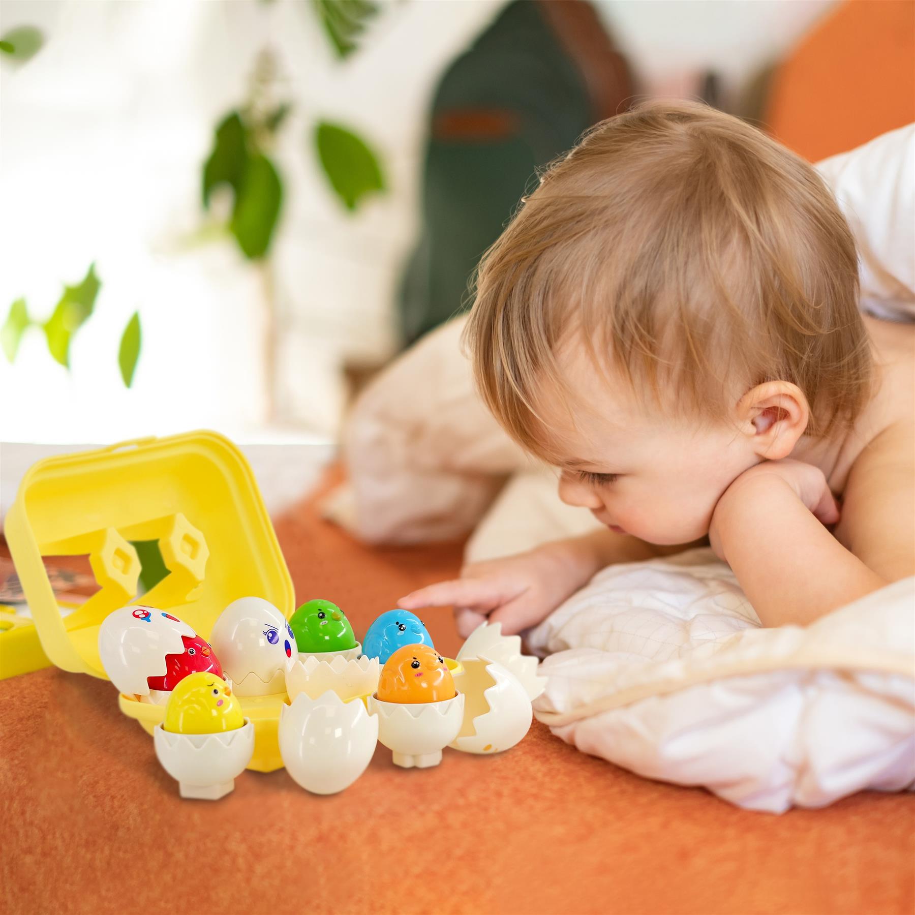 Assortment of colored plastic eggs and matching yellow container toy set.