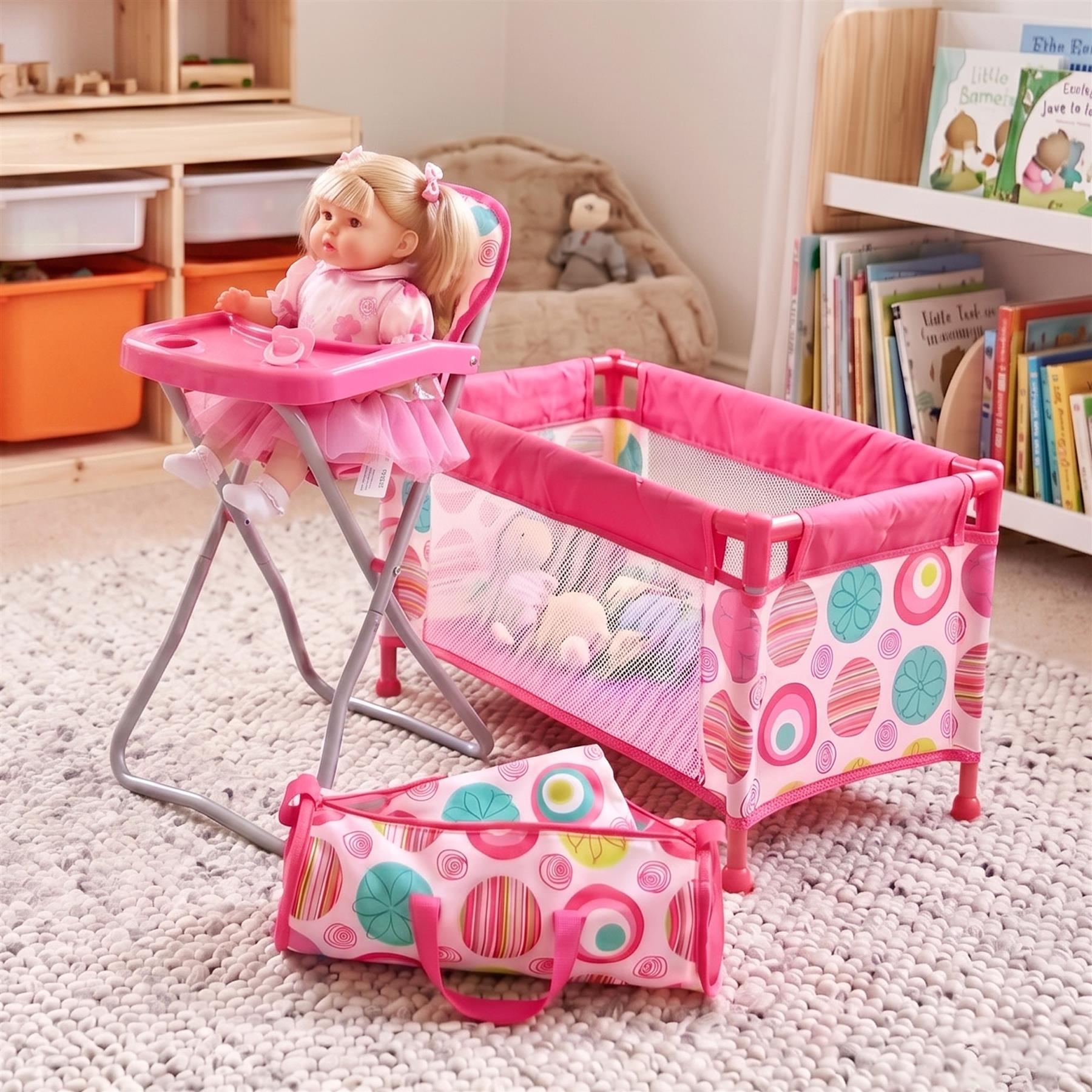 A doll set featuring a pink high chair, patterned crib, and matching storage carry bag.