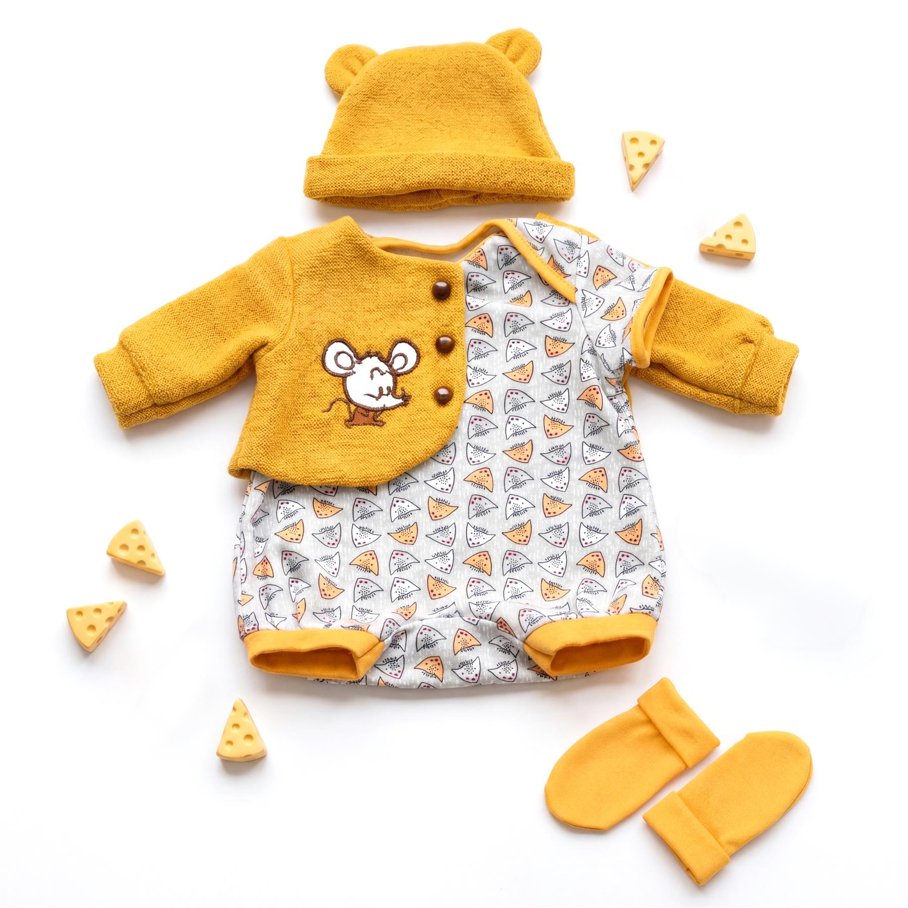 A yellow reborn doll clothing set includes a hat, embroidered shirt, patterned bottoms, and mittens.
