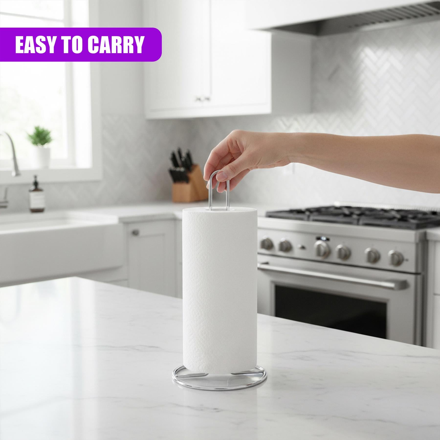 A white paper towel roll rests on a chrome cylindrical stand positioned on a kitchen counter.