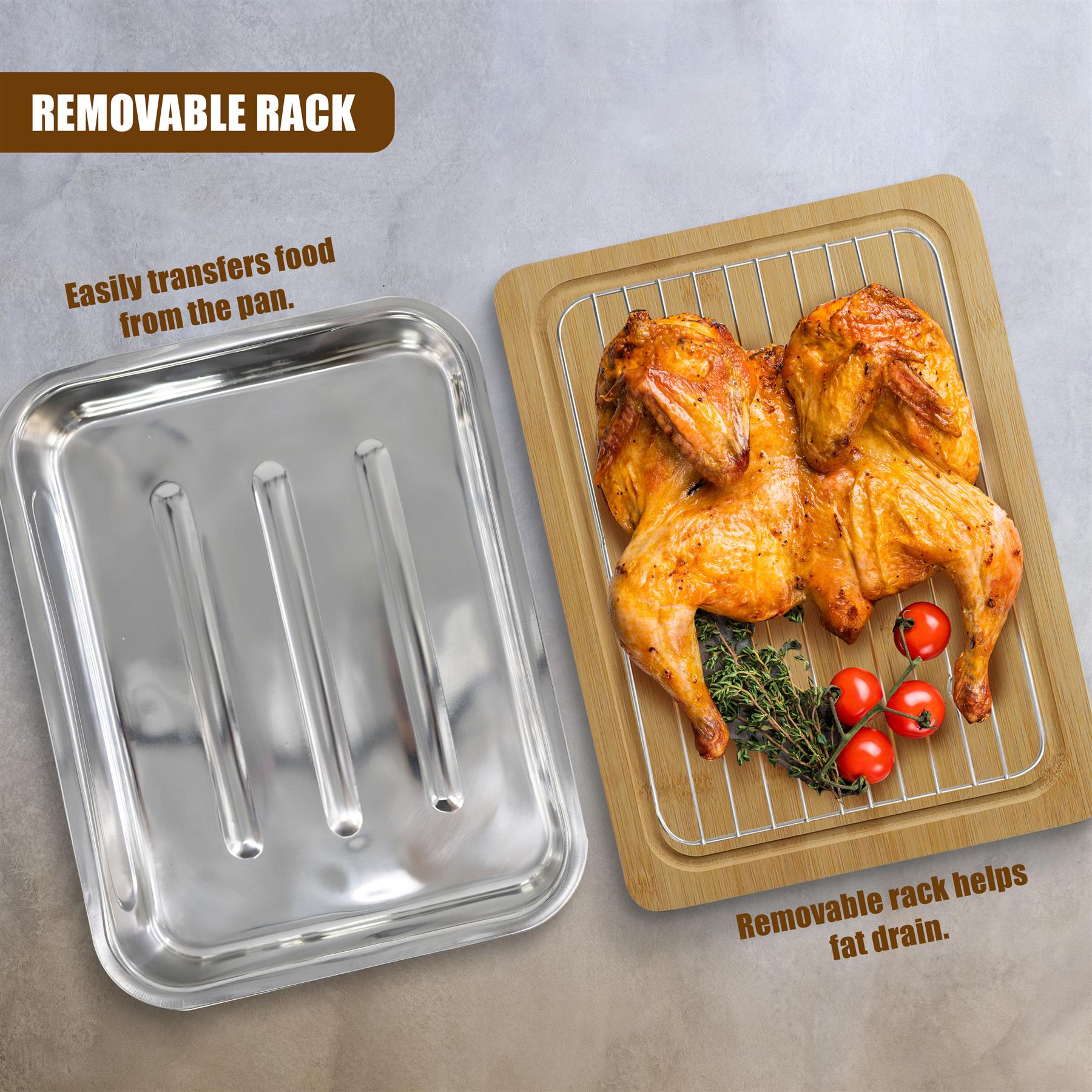 Metal roasting pan with removable rack next to a wooden tray with two roasted chickens and herbs.