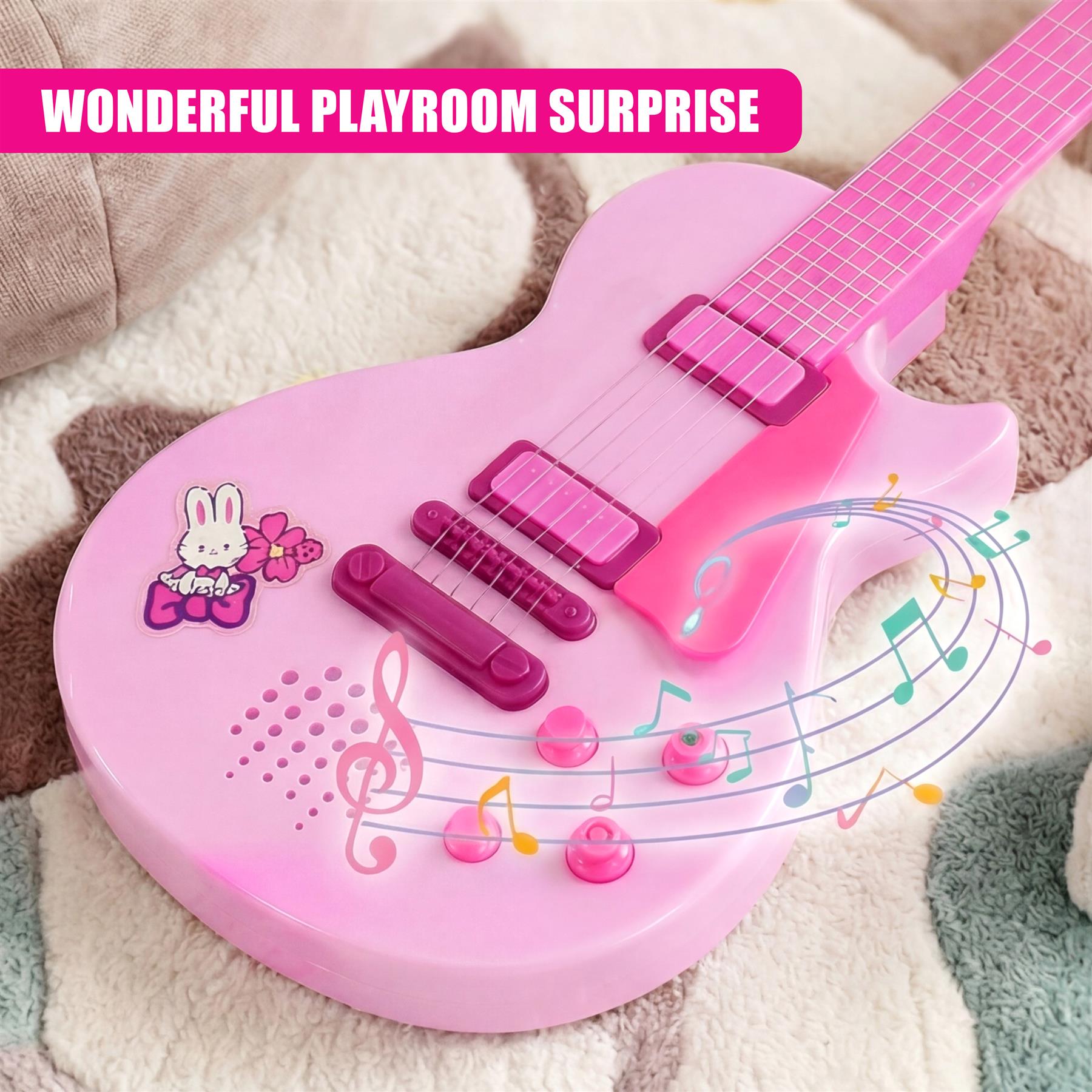 A bright pink miniature guitar toy adorned with bunny and musical note decals.