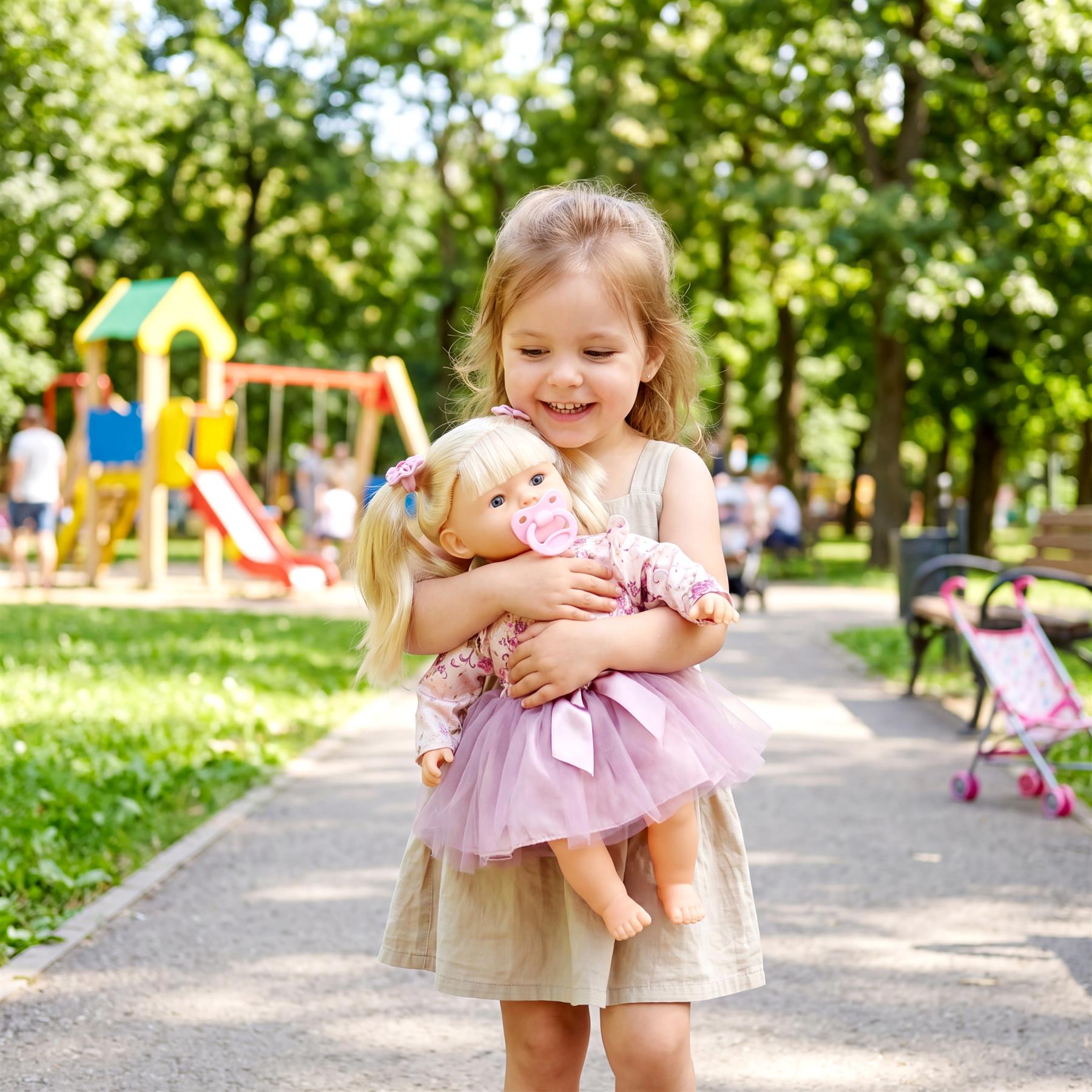 Young girl holds a blonde baby doll wearing a pink and white outfit outdoors.