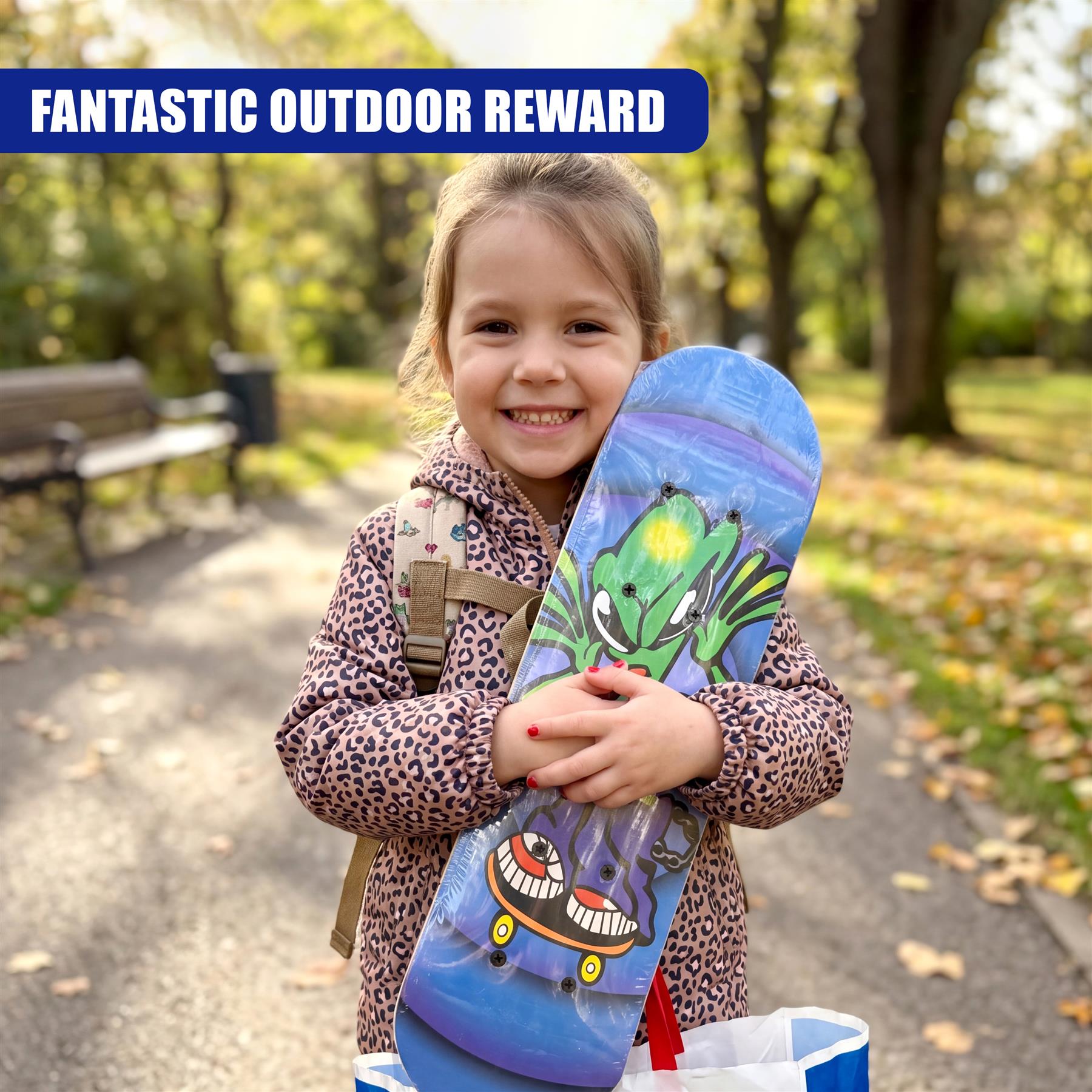 Skateboard featuring a graphic of a green creature and blue background designs.