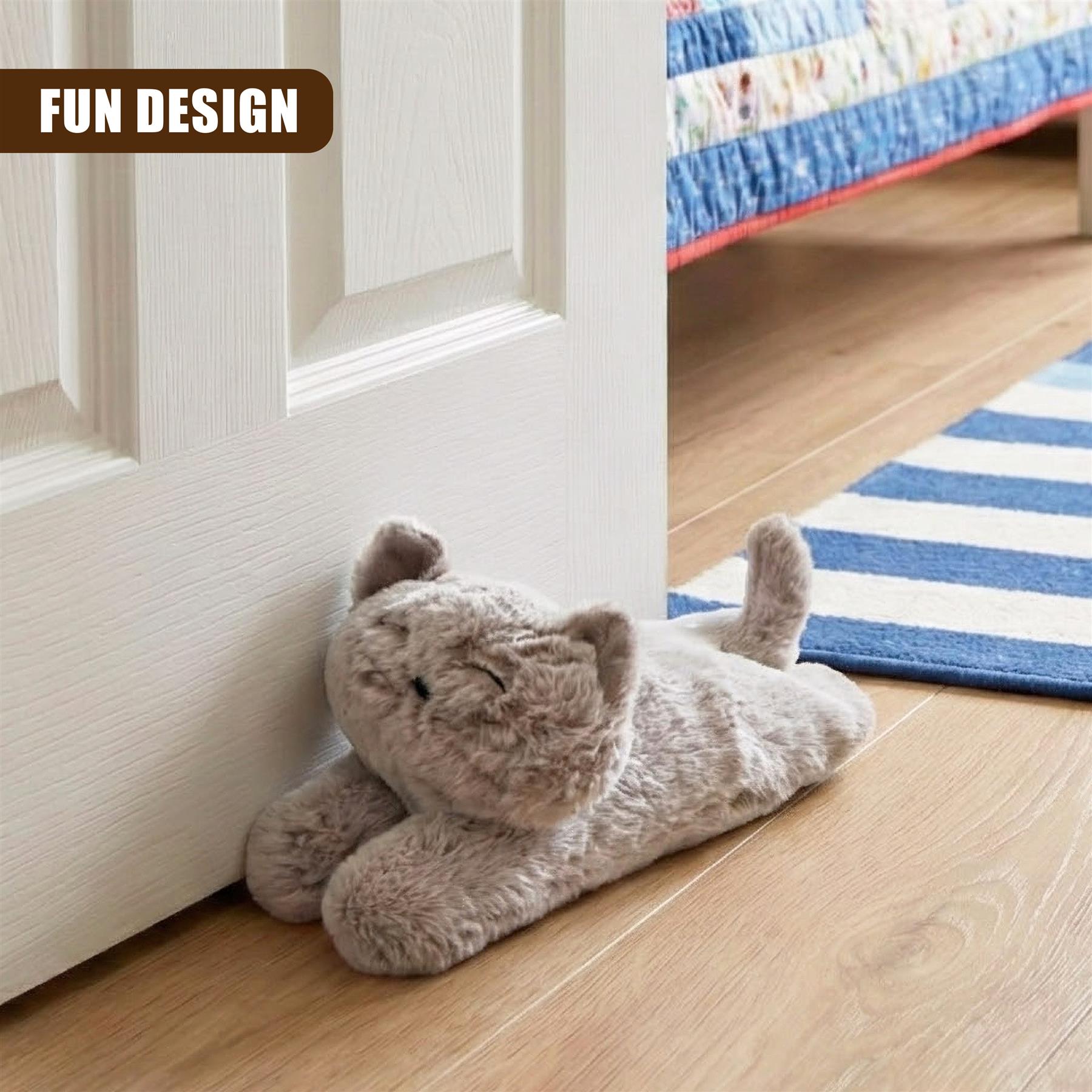 A stuffed toy cat placed on the floor and leaning against a door, with one paw resting on the door. It's a cozy and adorable design that would be perfect for pet lovers or anyone who enjoys a touch of whimsy in their home decor. - The Magic Toy Shop