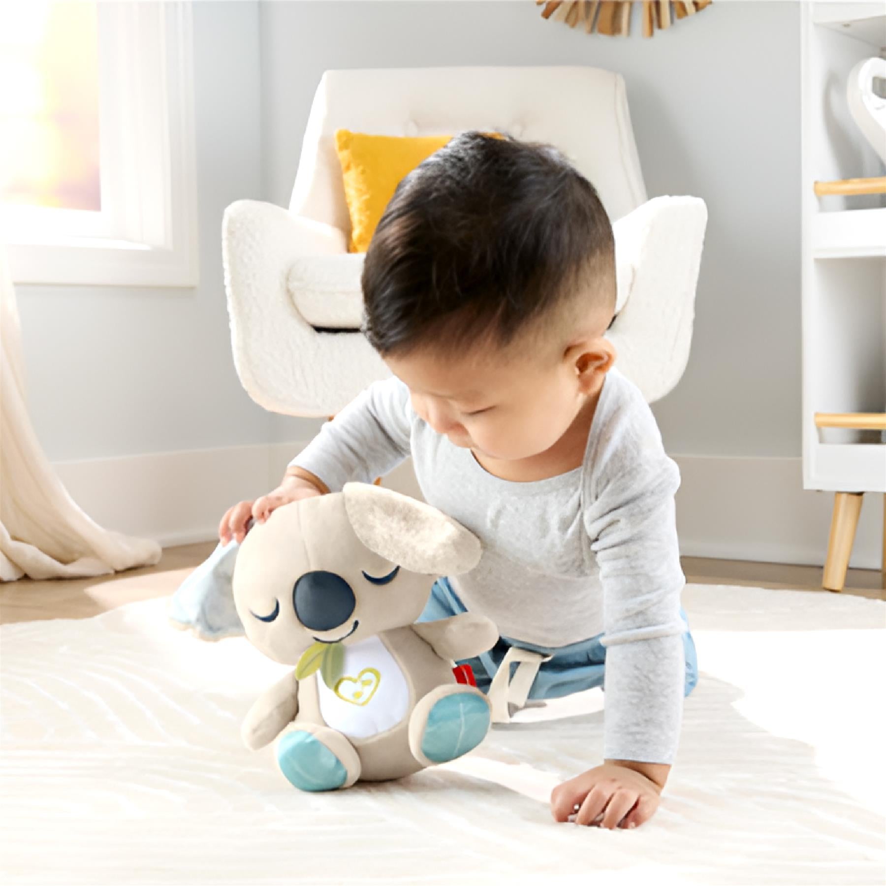 Koala plush toy featuring soft fabric and hanging teether elements for infants.