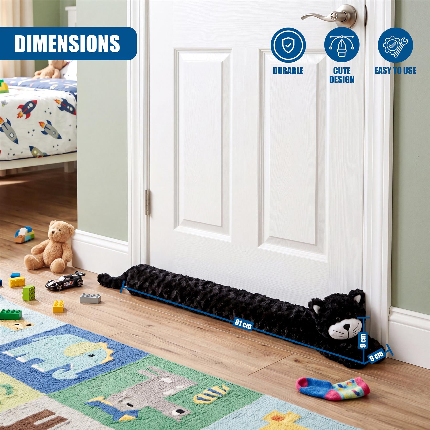 Plush black cat draught excluder positioned across a white closed interior door.