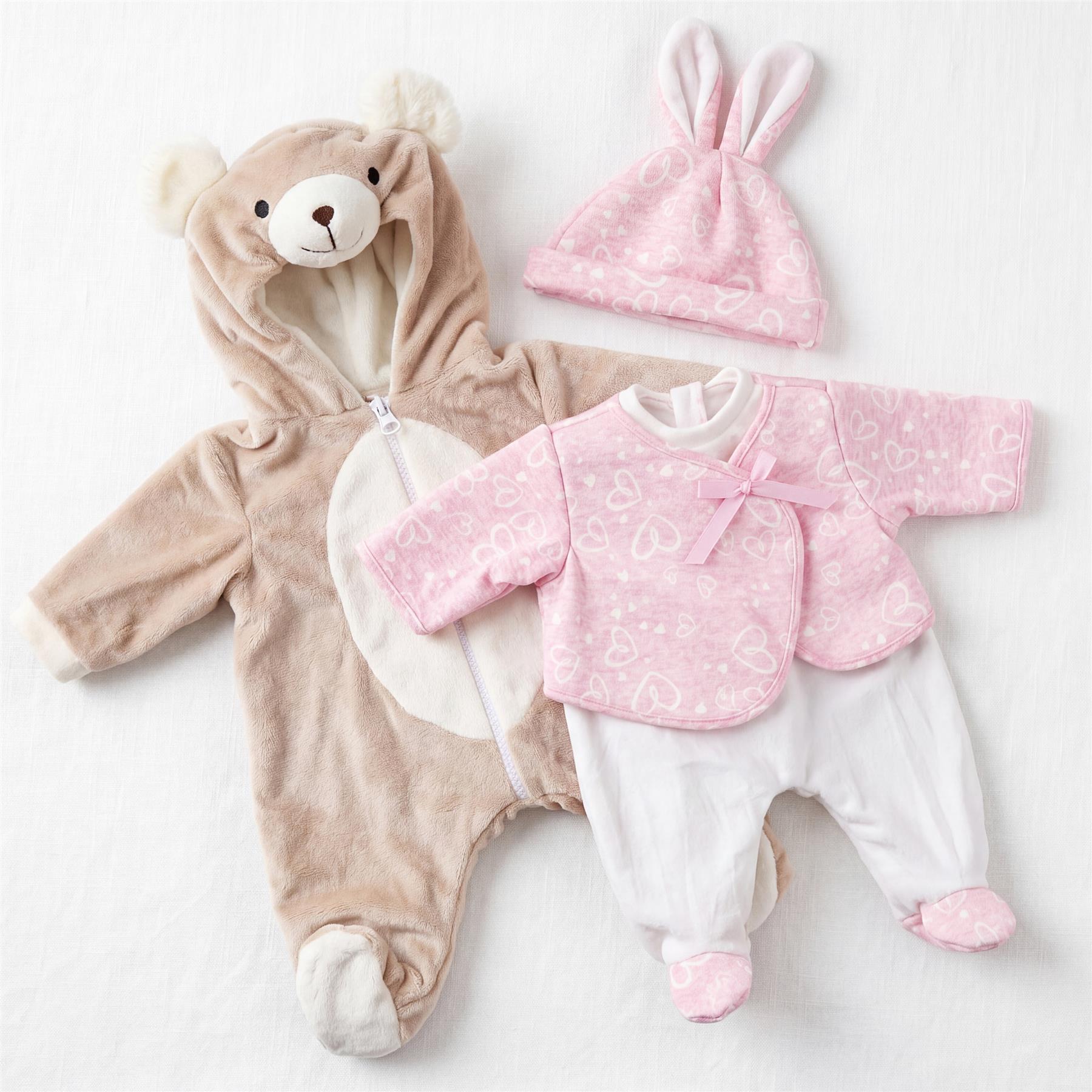 Plush bear jumpsuit, pink bunny headband, and coordinated pink and white baby outfit set.