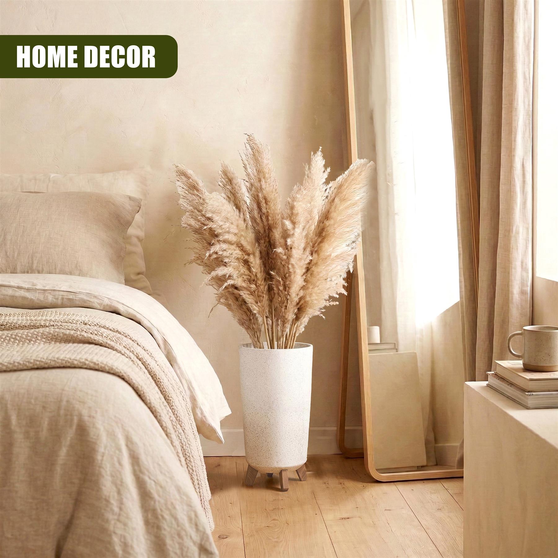 Pampas grass displayed in a tall white planter with small decorative legs.