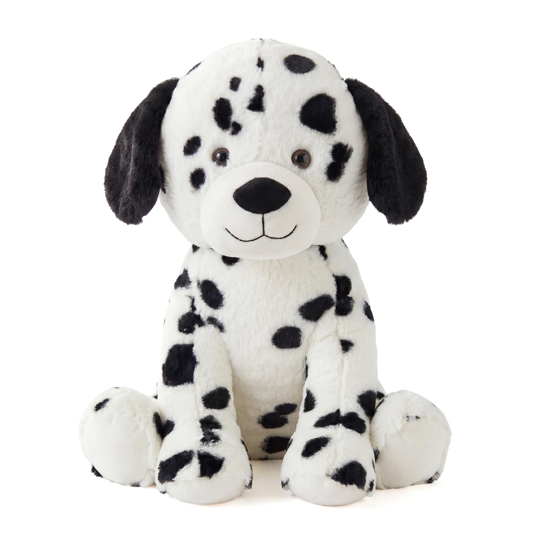 White plush stuffed dog toy patterned with black spots, resembling a Dalmatian.