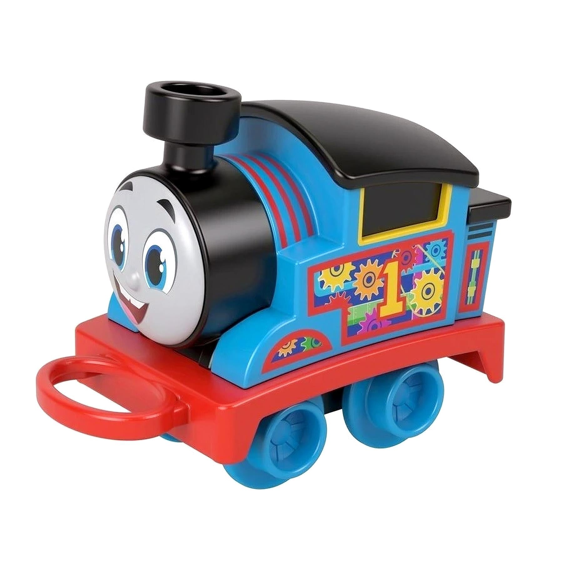 The toy train features blue and red plastic, a locomotive engine, and an activity play table.
