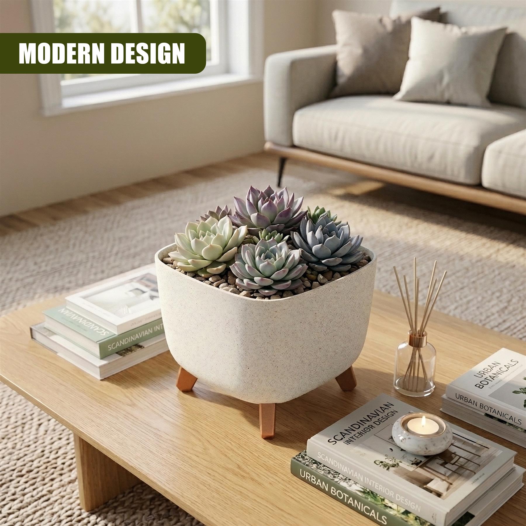 Cream ceramic pot with wooden legs displays various green and purple succulents on a wooden coffee table.