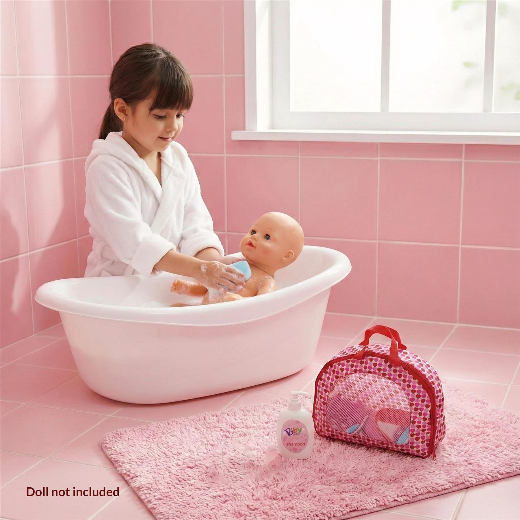 A young girl in a white bathrobe is shown playing with a baby doll in a bathtub, while a pink bag and a bottle of baby shampoo are placed nearby. - The Magic Toy Shop