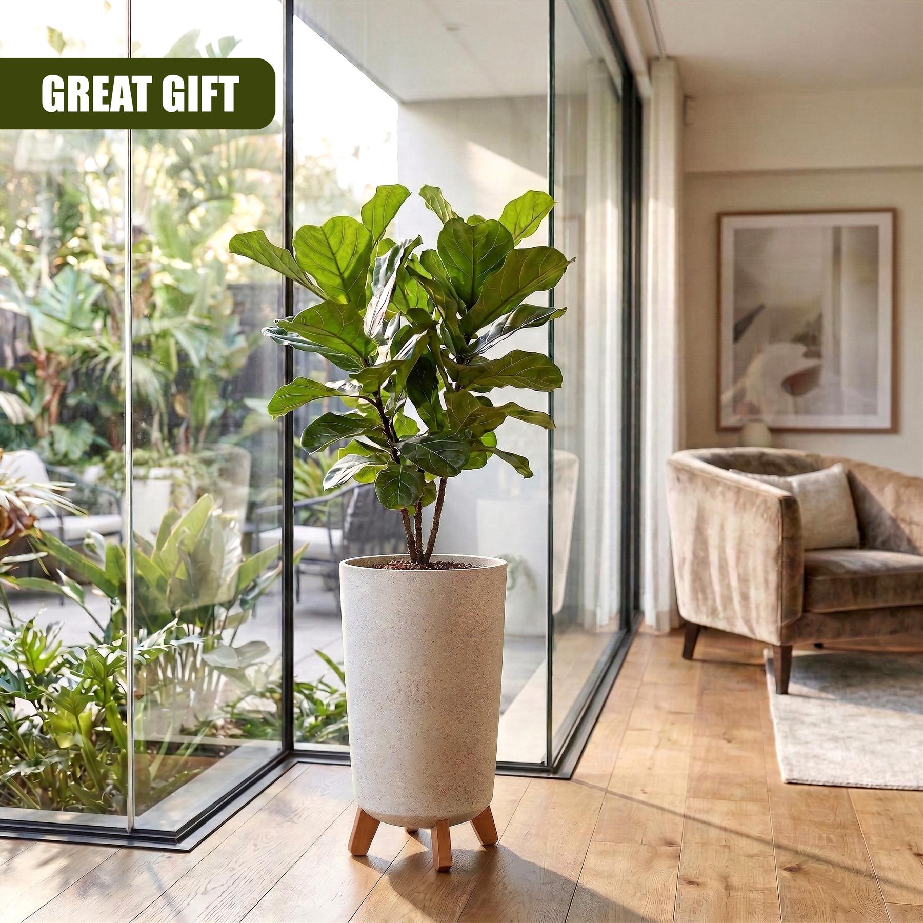 A leafy indoor plant is potted in a beige, tapered planter supported by short wooden legs.