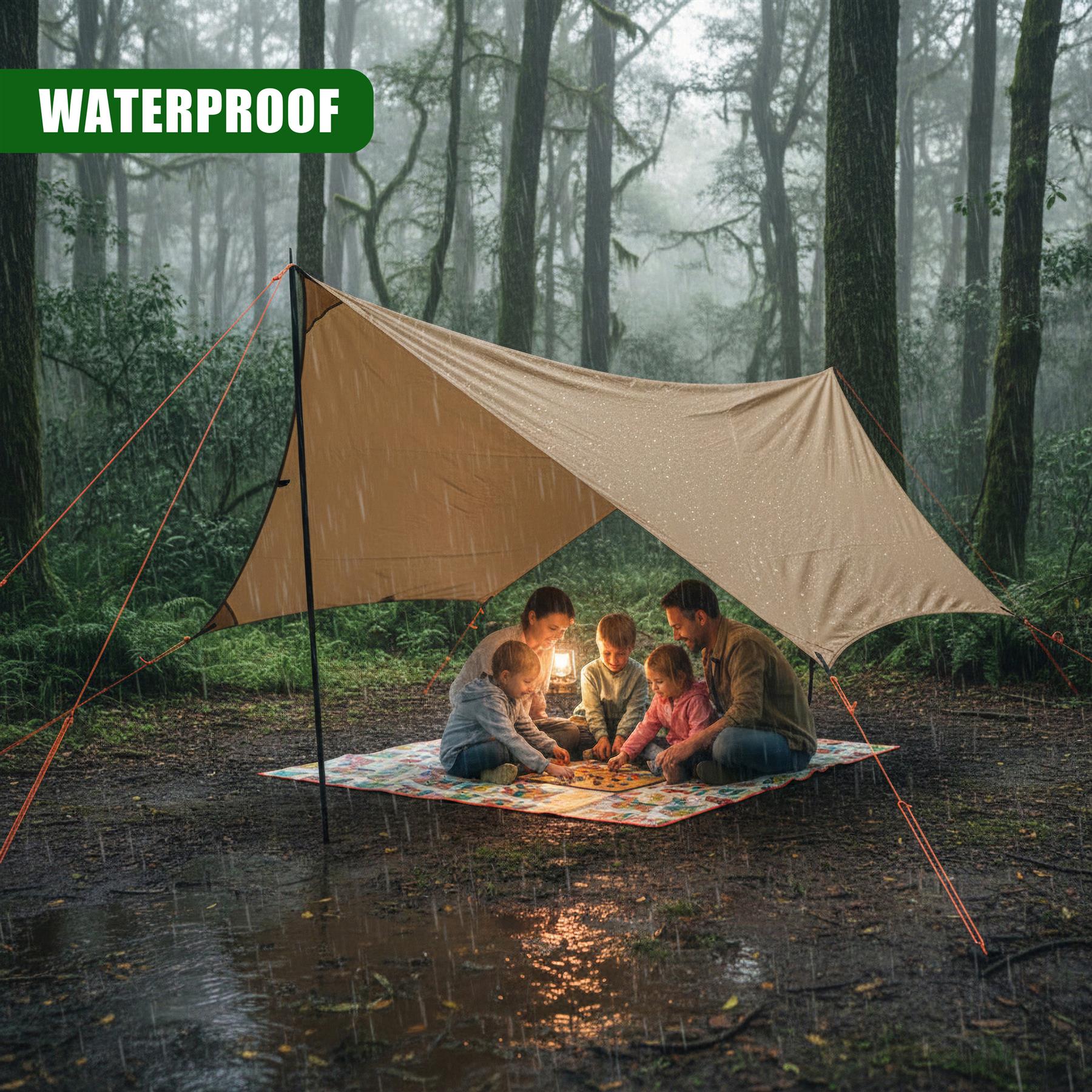 Tent shelter set up in a rainy forest with people sitting inside on a ground mat.