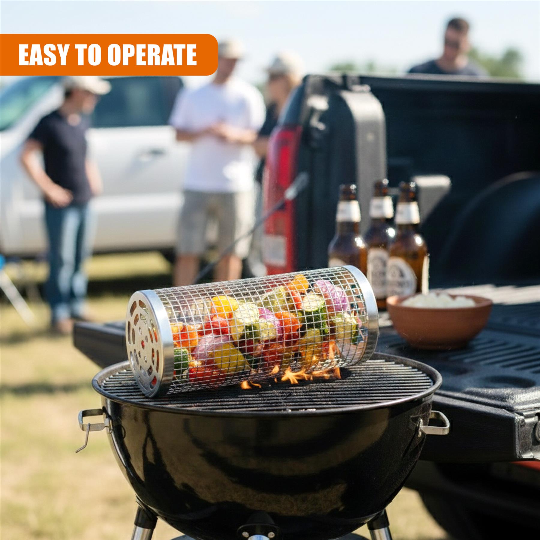 A circular grill basket holding colorful cooking vegetables rests on a black kettle grill grate.