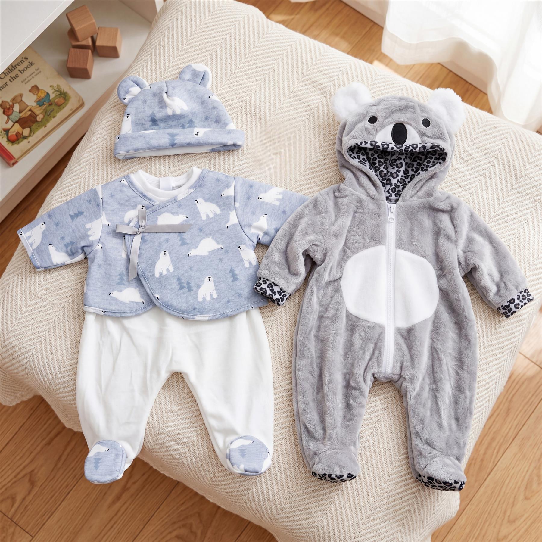 Doll outfit set including a gray bear jumpsuit, a coordinating blue top and pants, and a hat.