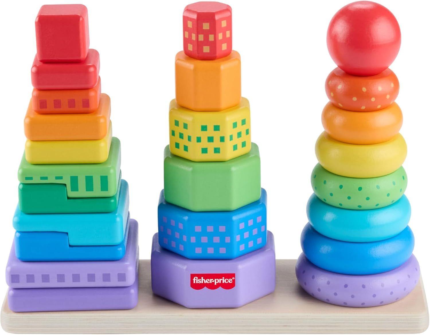 Image showing three vertical towers of stacking toys, consisting of blocks, patterned shapes, and rings.