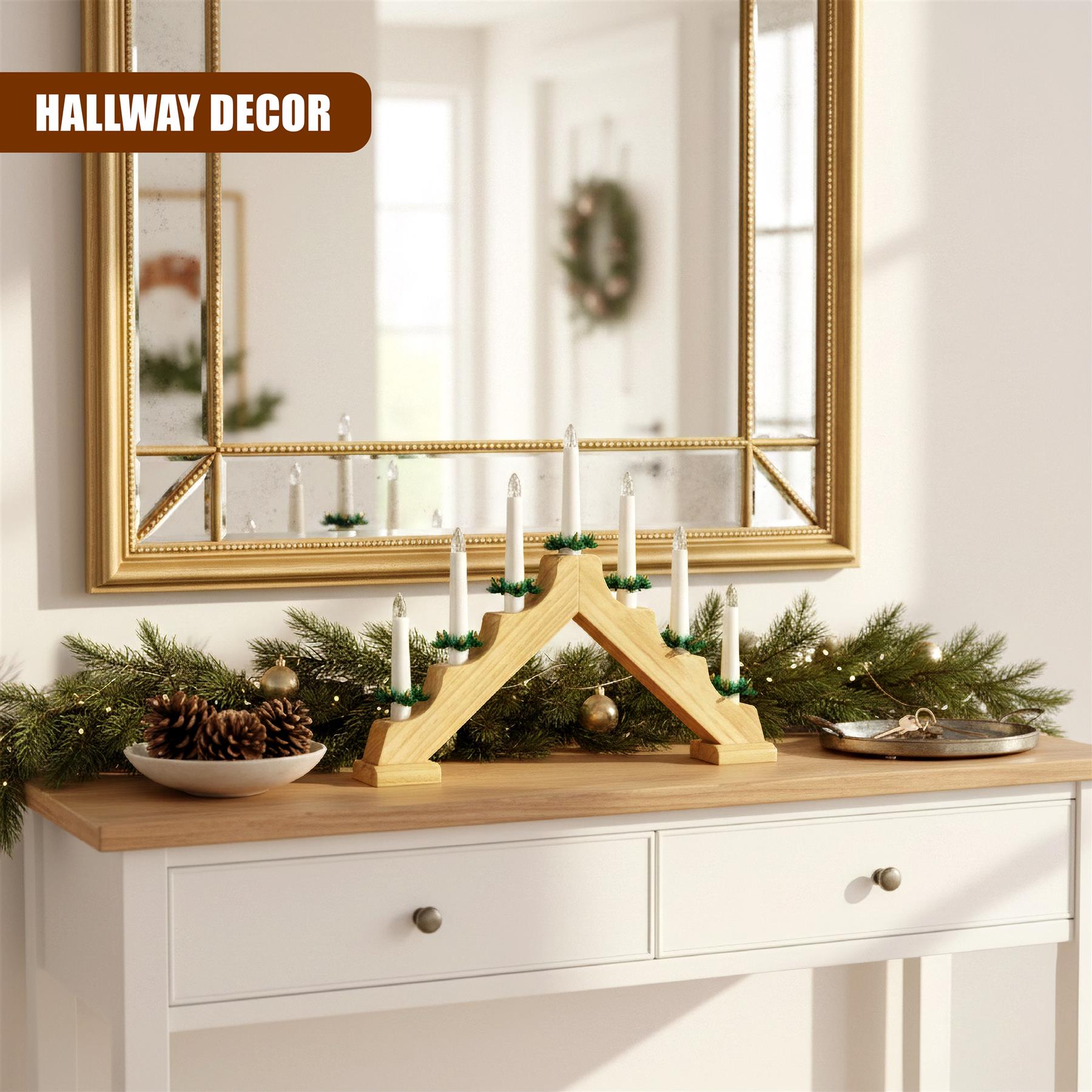 A wooden, multi-tiered candle holder with 7 white candles and greenery, placed on a wooden table with a mirror in the background, reflecting a Christmas-themed wall. - The Magic Toy Shop