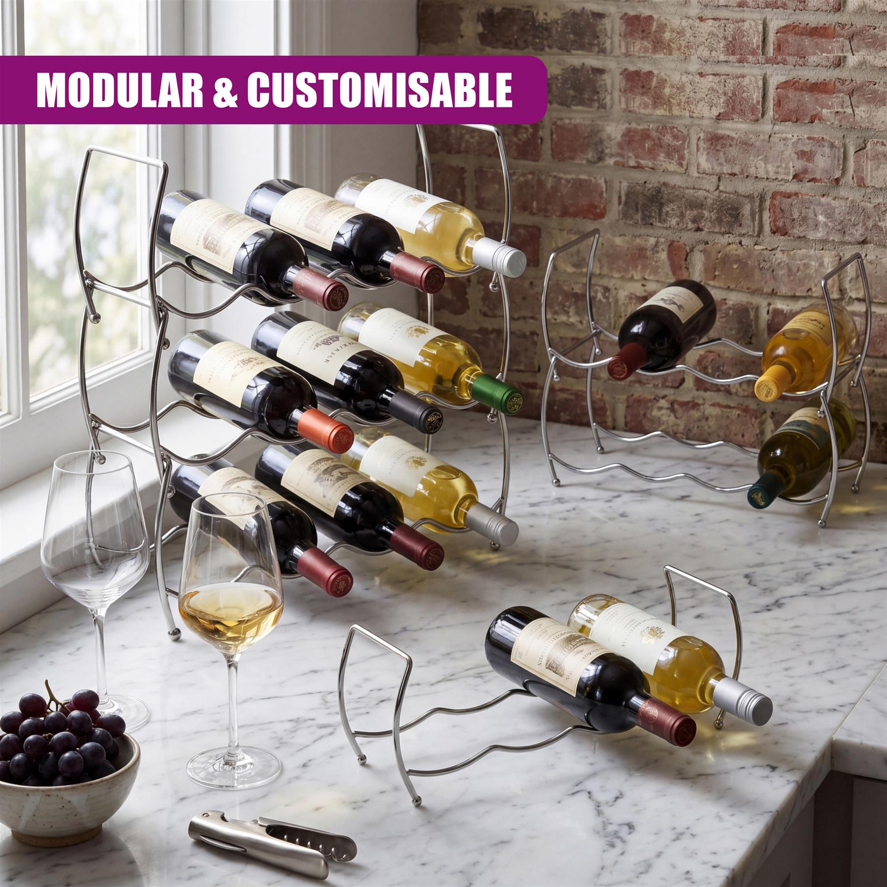 Tiered metal wine rack holding bottles, displayed on marble near grapes and wine glasses.