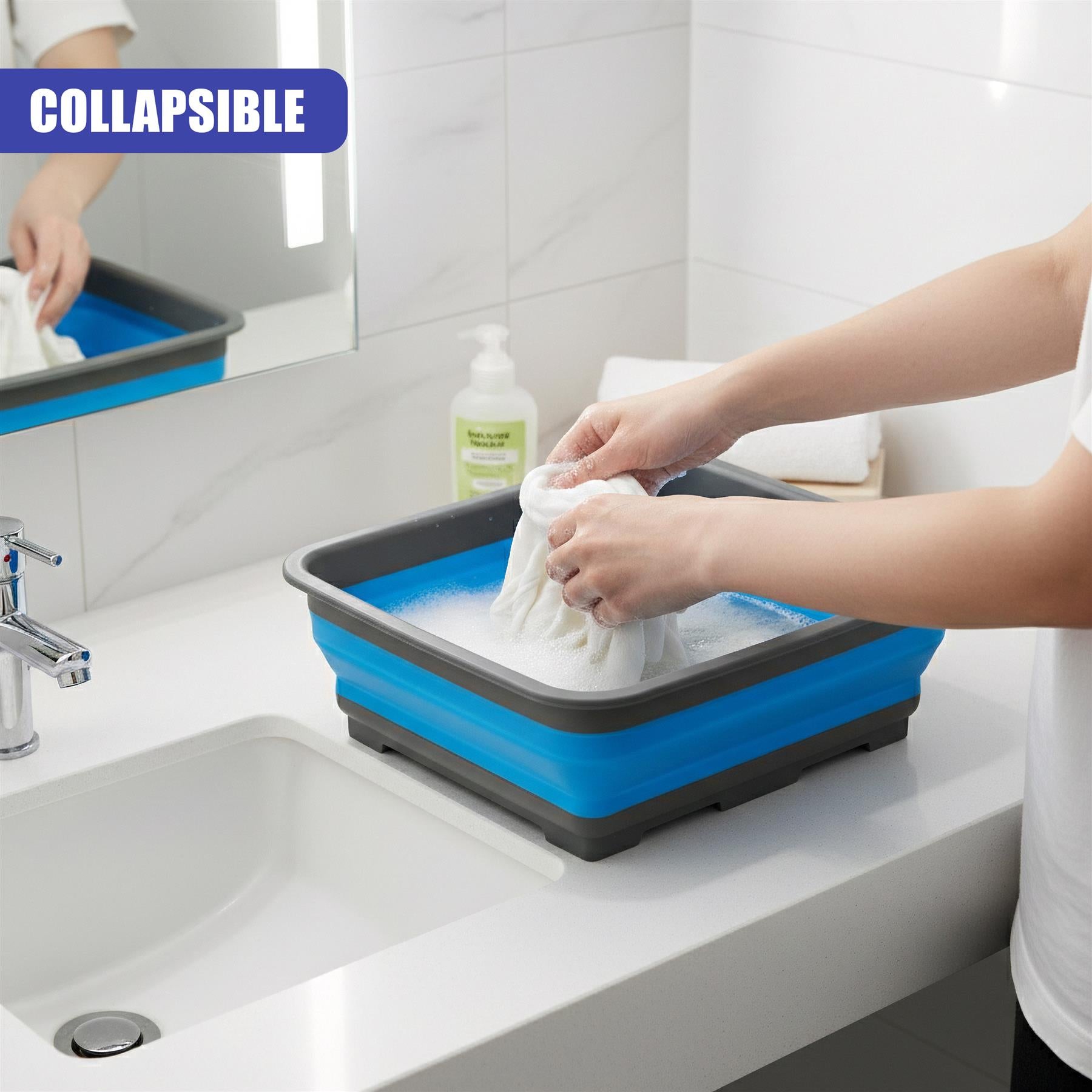A person washes items in a shallow blue folding washing up bowl placed on the kitchen sink counter.