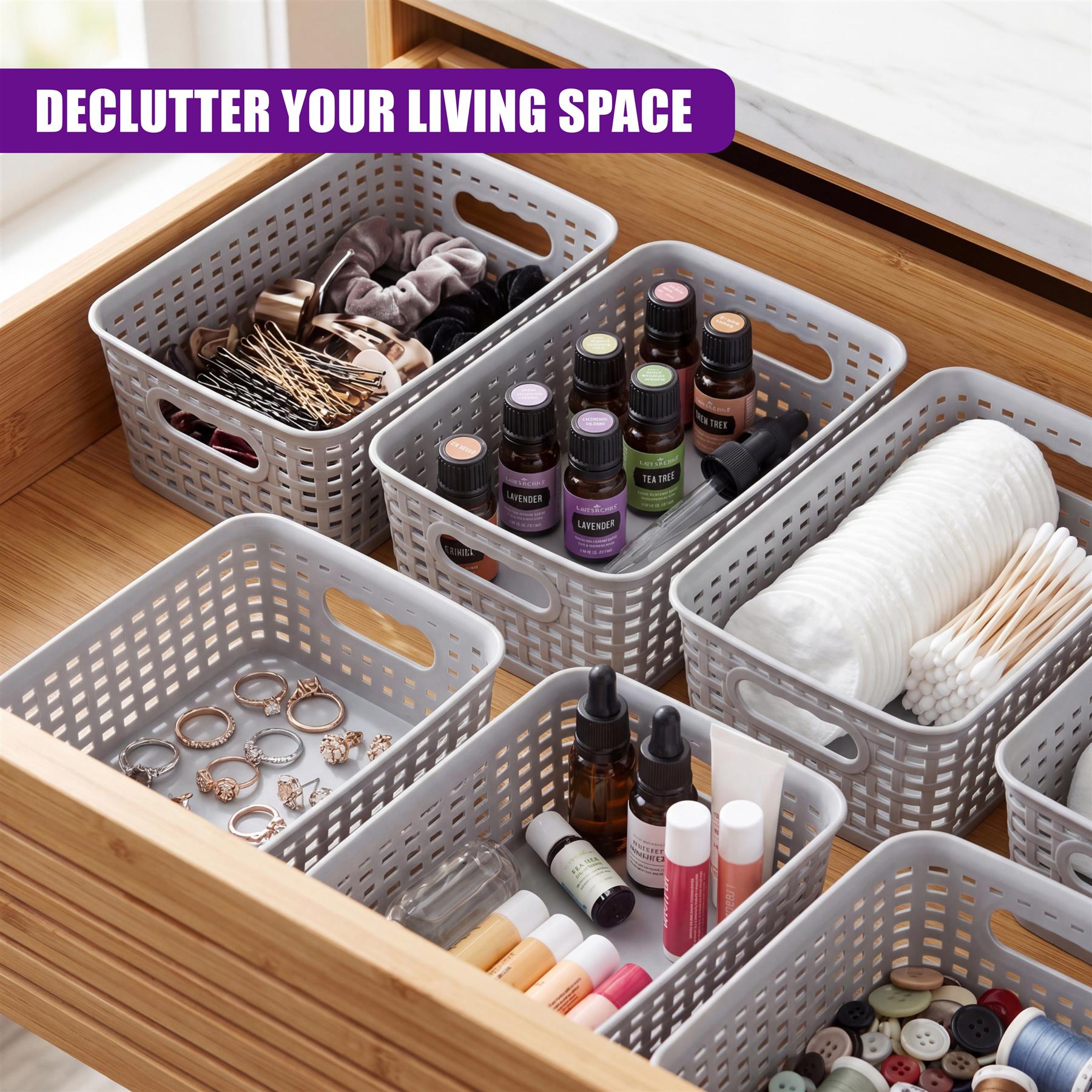 A collection of white storage baskets containing jewelry, bottles, and various crafting notions.