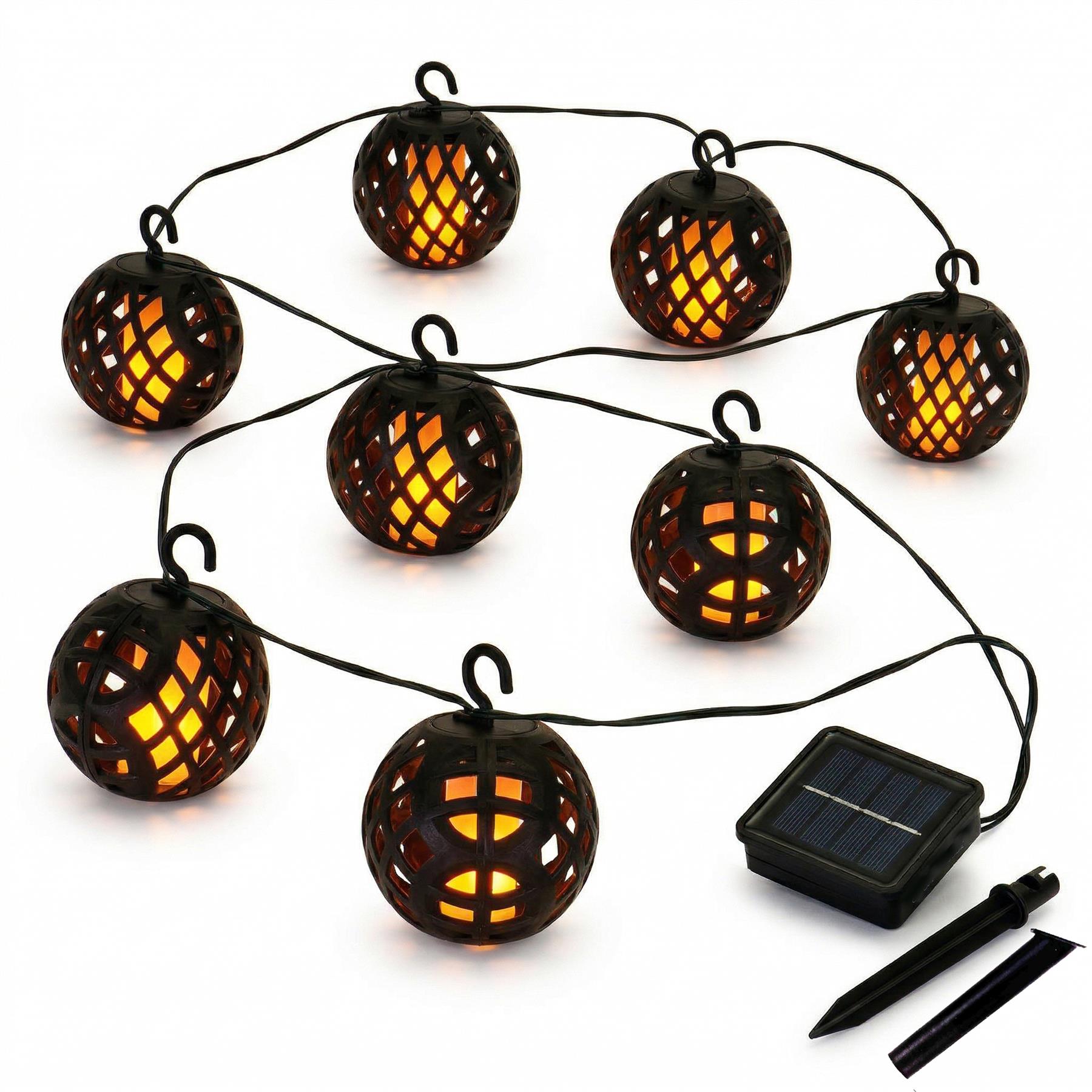 Multiple woven rattan solar globe lights strung together and powered by a photovoltaic panel.