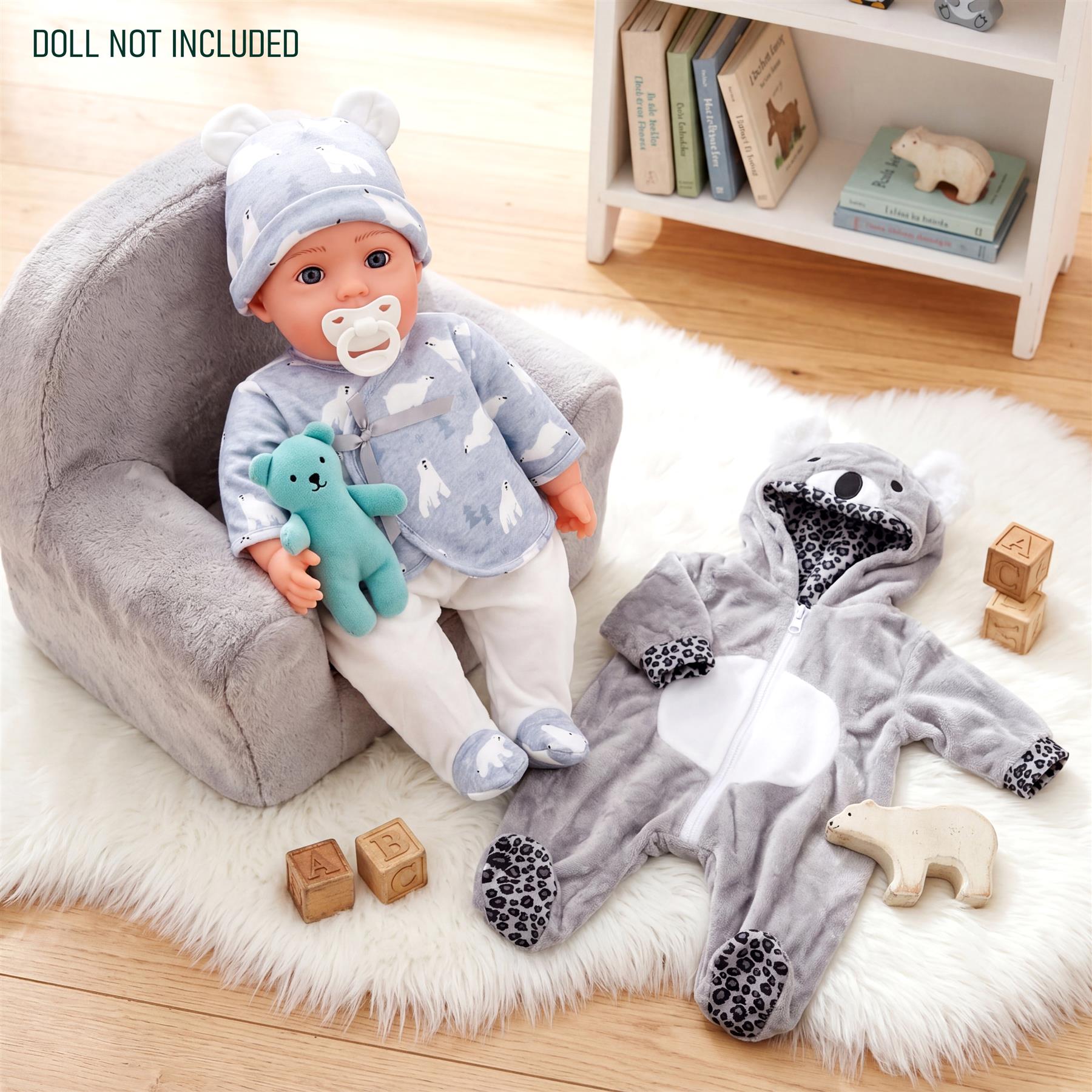 Set of two doll clothes: a light blue patterned outfit and a grey bear-themed hooded sleeper.