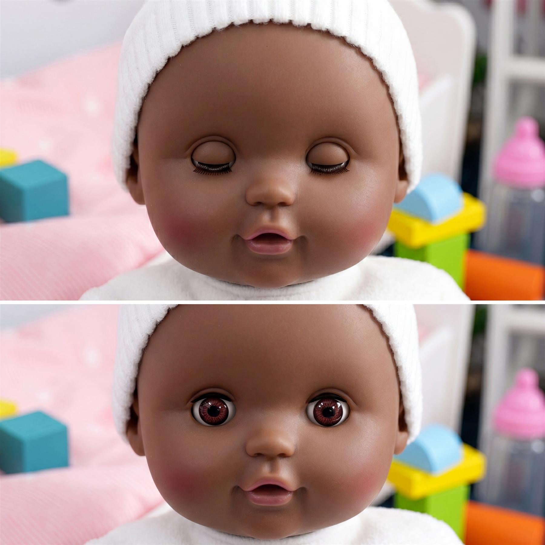 Black fabric doll named BiBI shown sleeping, measuring approximately forty centimeters in length.