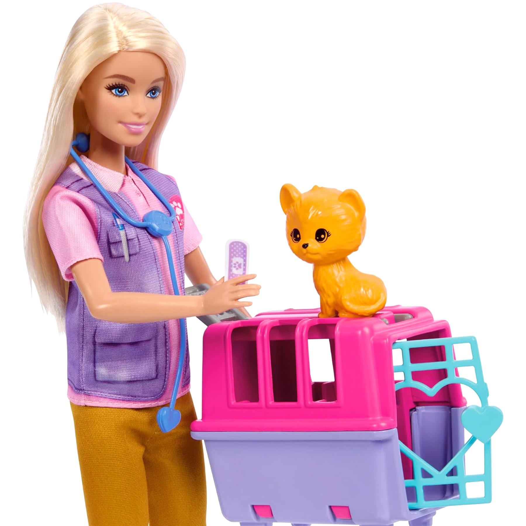 A blonde doll in scrubs and stethoscope stands with a puppy and a plastic rescue playset.