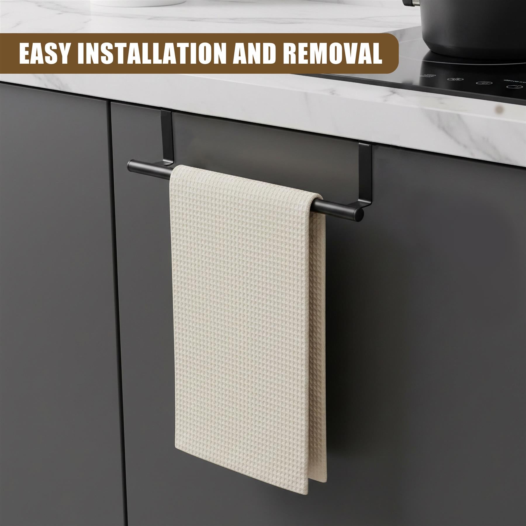 Black metal towel rail attached to a cabinet unit displaying a folded beige tea towel.