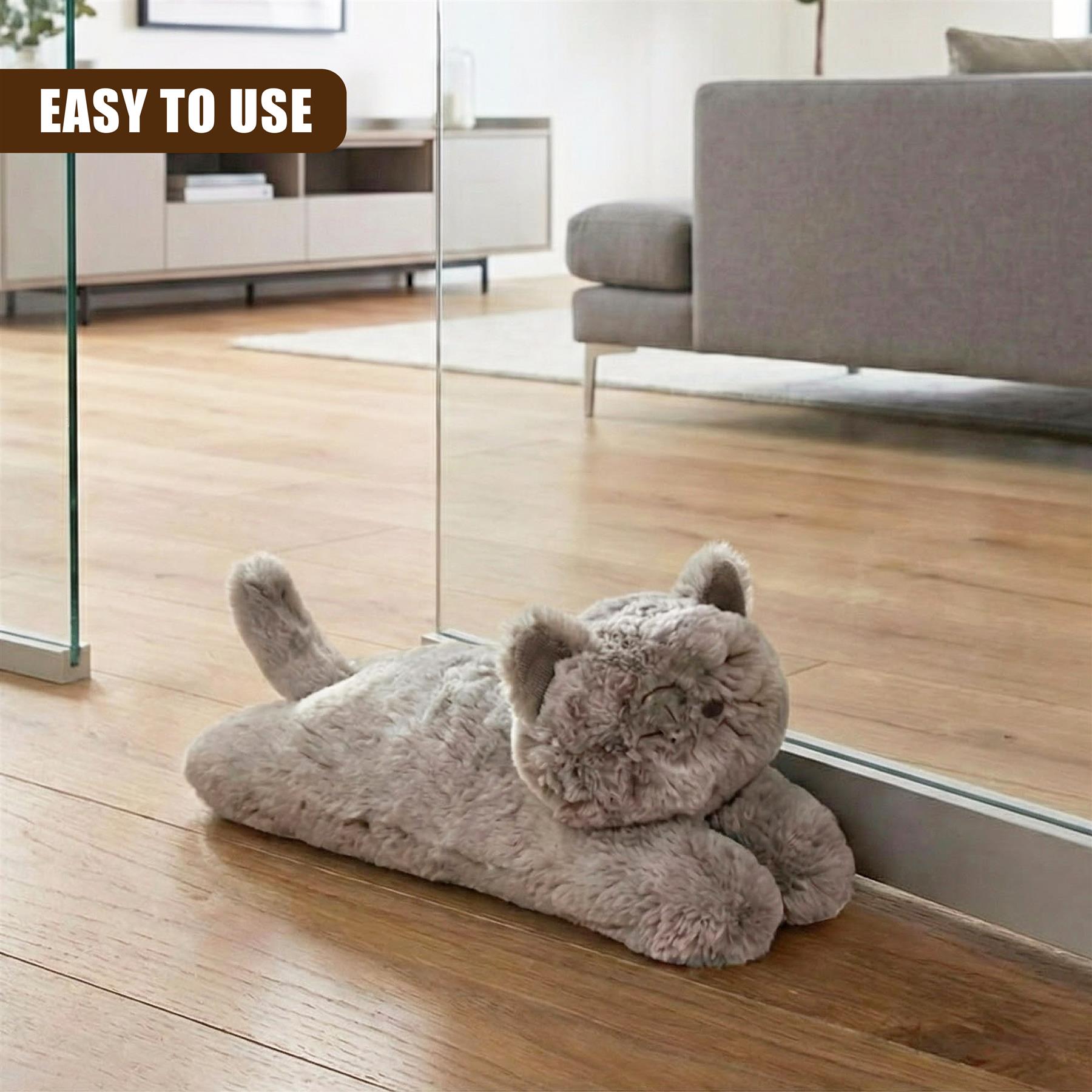 "Stuffed cat sitting on floor near window, with caption 'Easy to use'." - The Magic Toy Shop