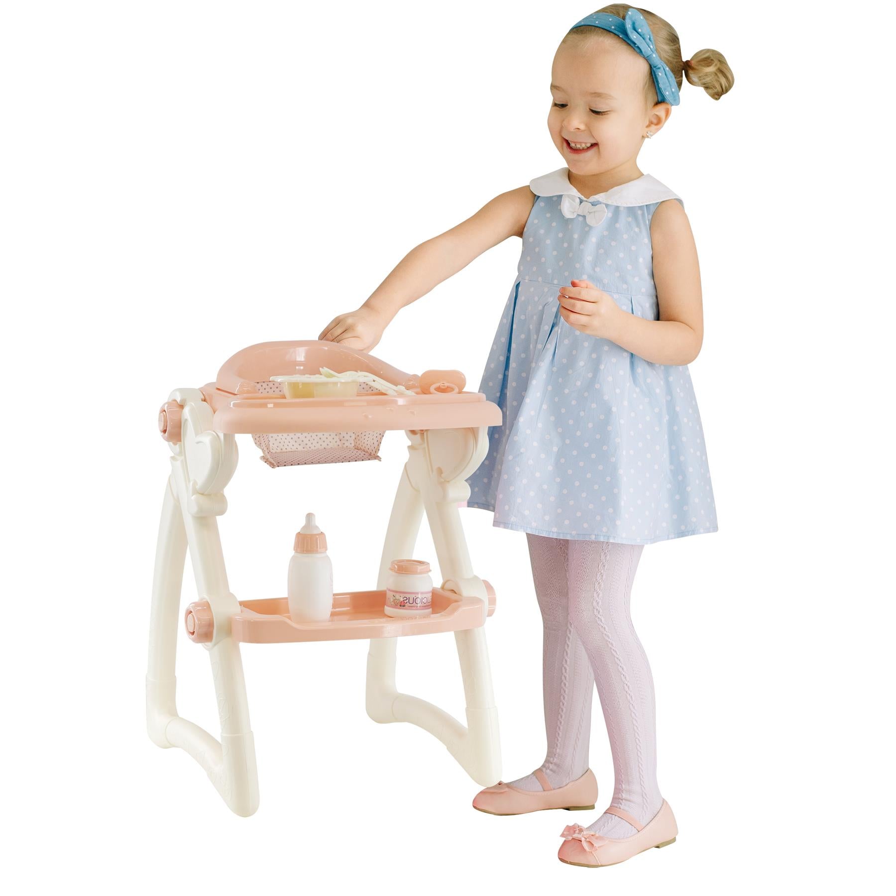 Little girl holding a doll high chair, pink and white polka dots. - The Magic Toy Shop