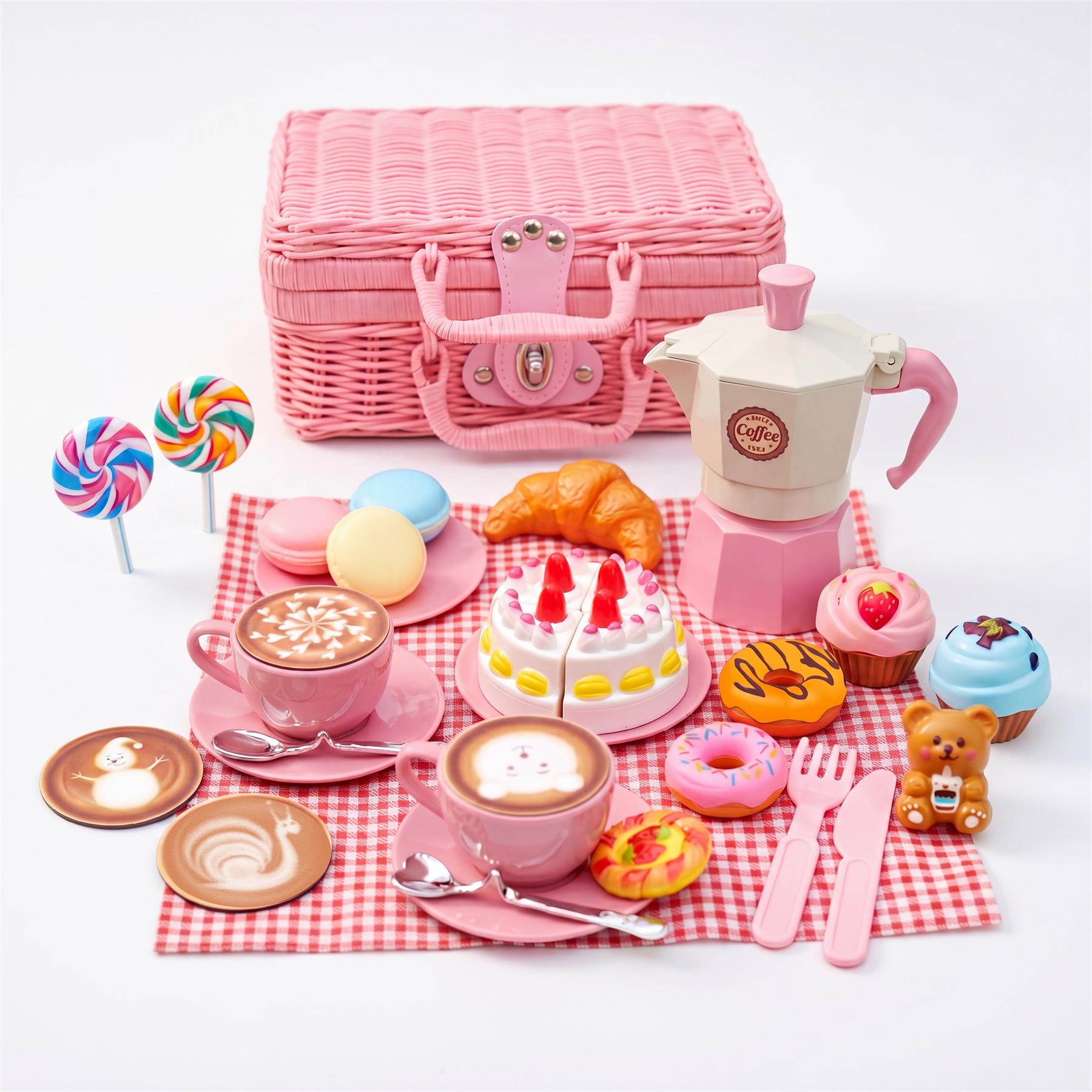 Pink miniature tea party set featuring a basket, teaware, assorted pastries, and candy arrangement.
