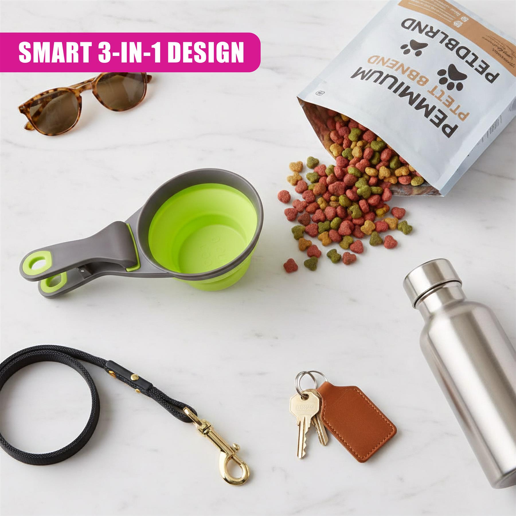 A pet food scoop, kibble bag, sunglasses, leash, tags, and a silver container rest on a white surface.