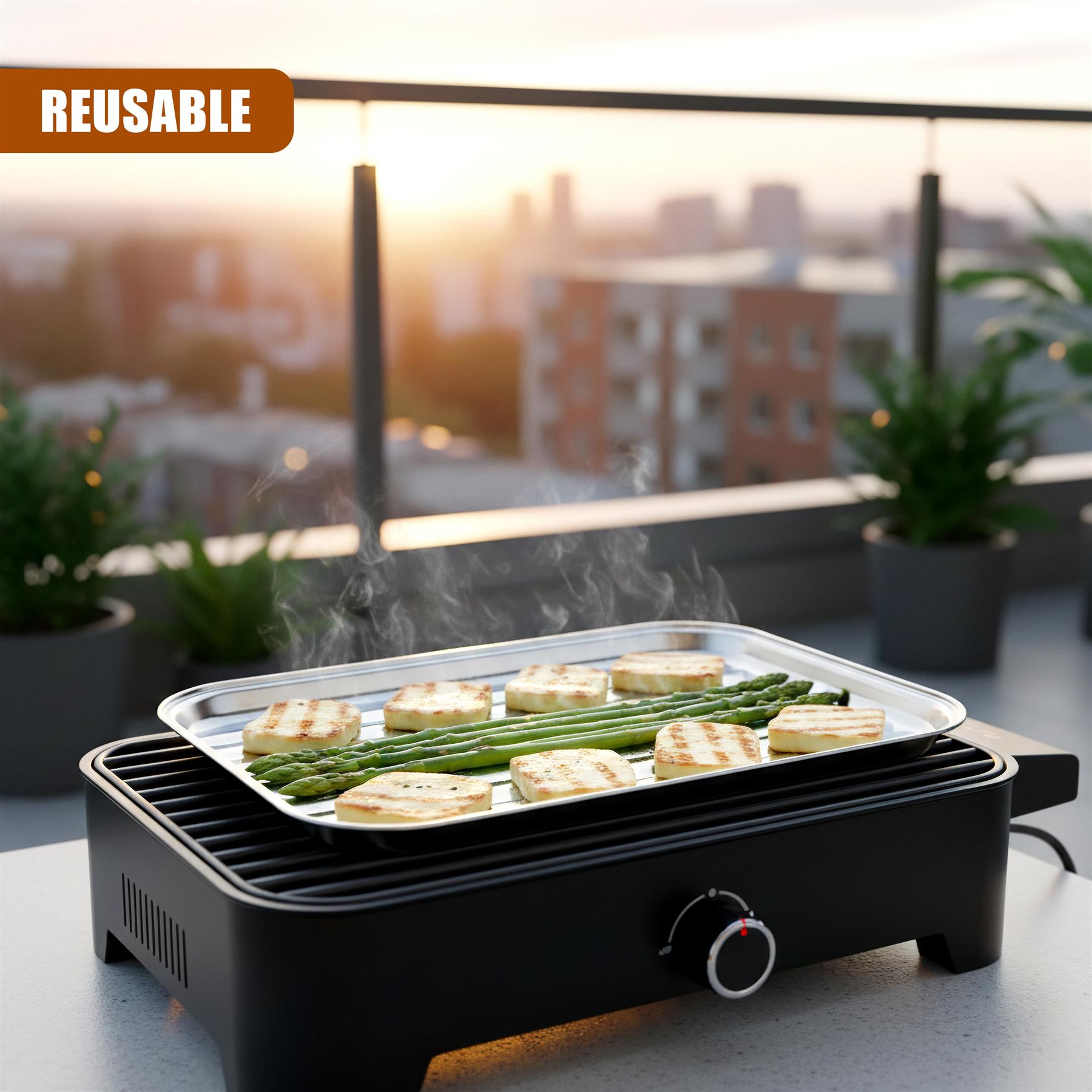 Grilled asparagus and bread pieces steam on a modern black electric cooking tray.