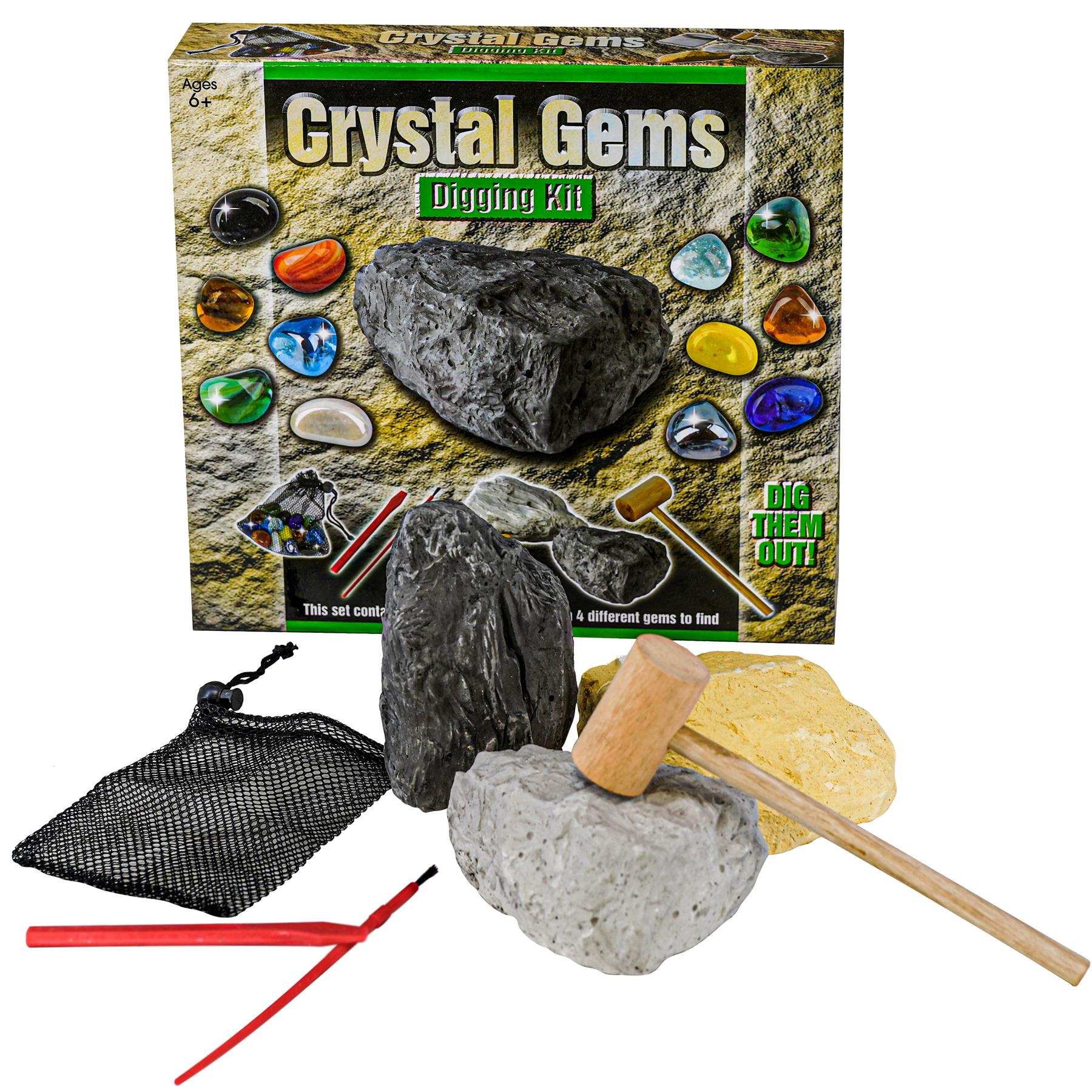 The set contains a box, tools, a black mesh bag, and natural colored rocks for digging imitation gems.