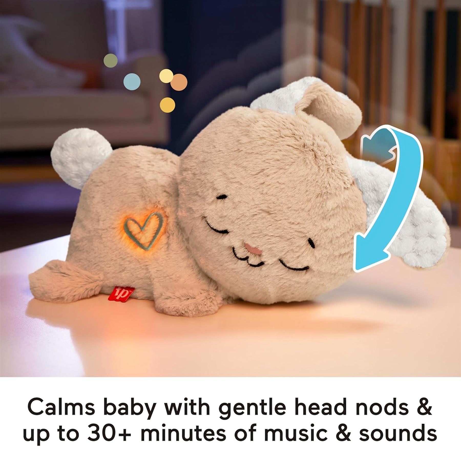 Soft, light brown plush bunny toy with glowing heart detail lying on a flat surface.