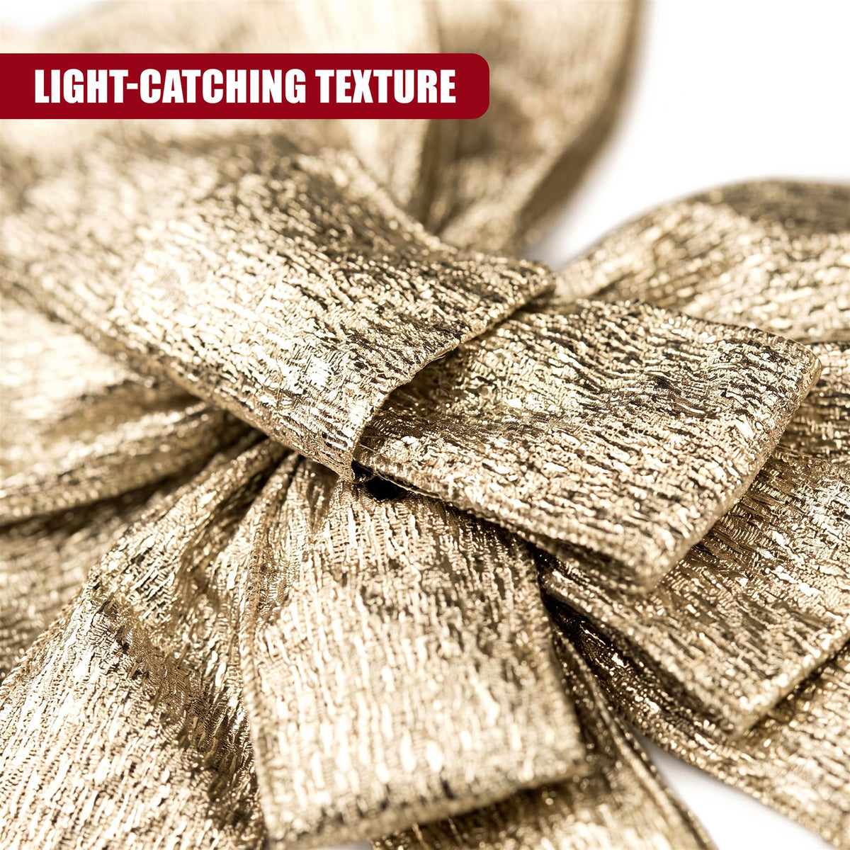 A close-up shows a large, shimmering gold Christmas tree bow with trailing ribbons