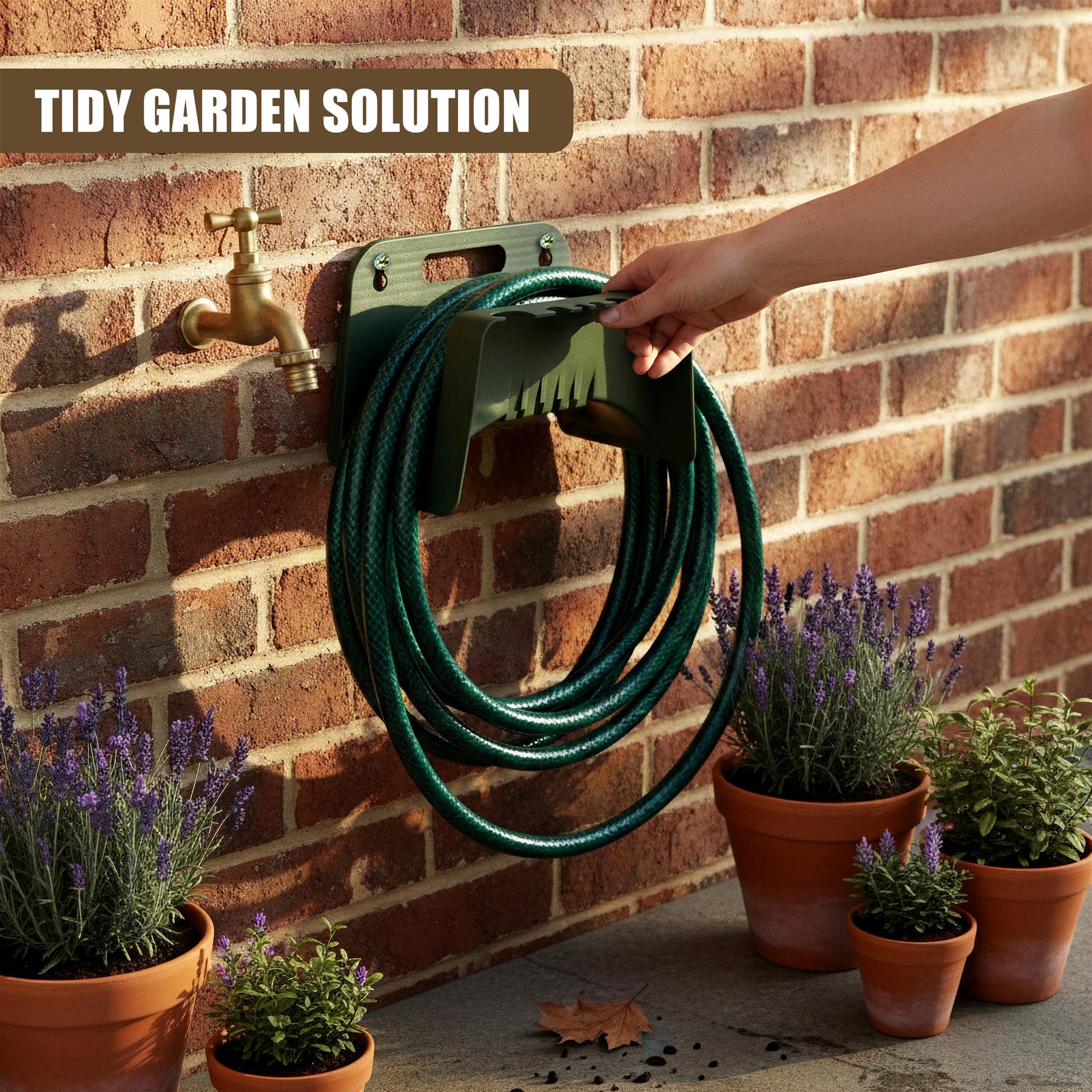 The holder mounts to a brick wall above a spigot, supporting a coiled green garden hose.