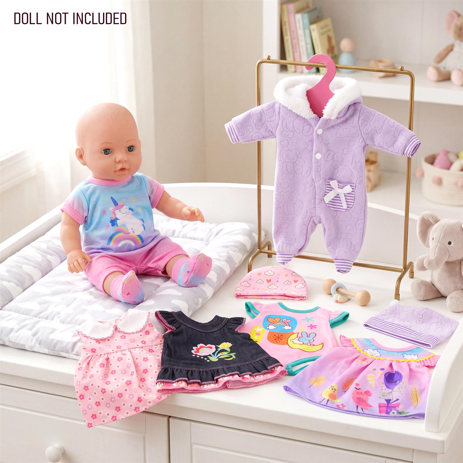 A set of six doll clothes includes a purple sweater, patterned dresses, and various colored tops.