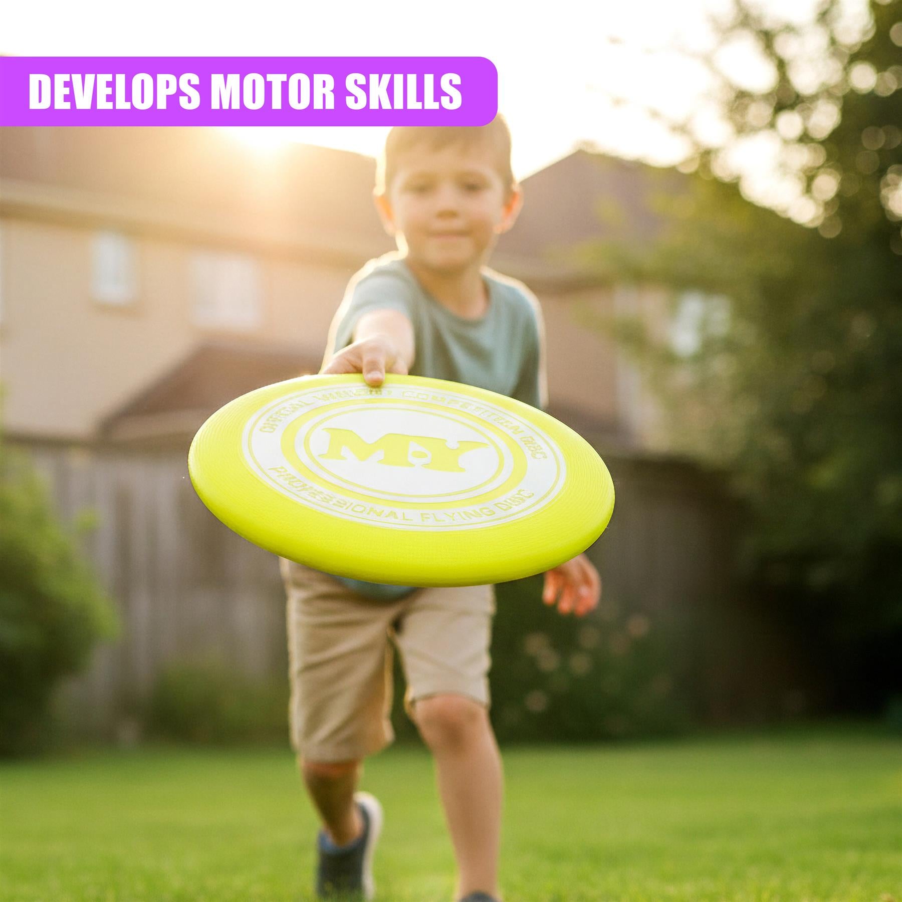 A bright yellow plastic frisbee is held by a child in an outdoor grassy setting.