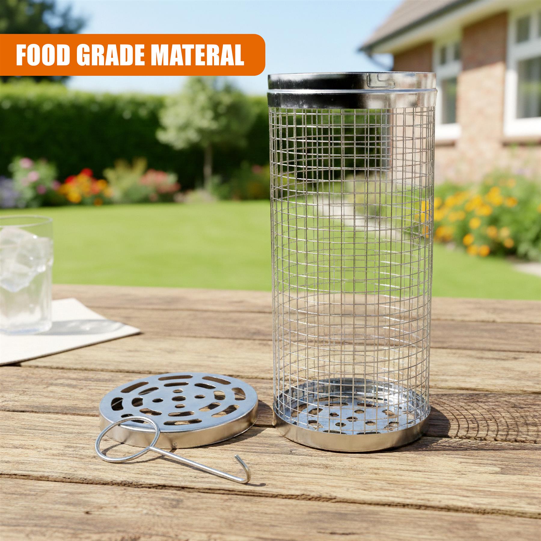 Stainless steel mesh cooking basket, perforated plate, and wire hook displayed on a wooden surface.
