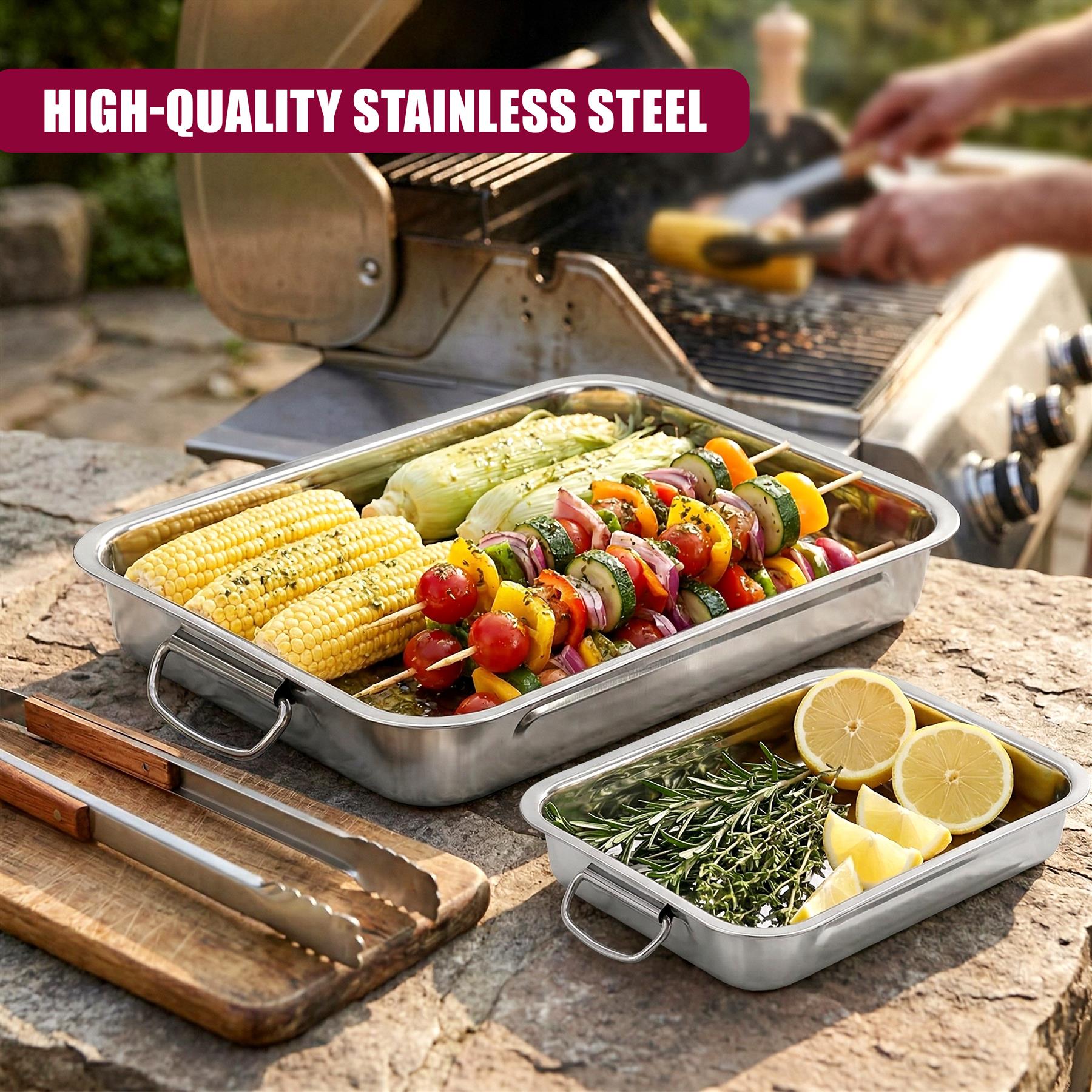 Three stainless steel roasting trays filled with corn, vegetables, herbs, and skewers.