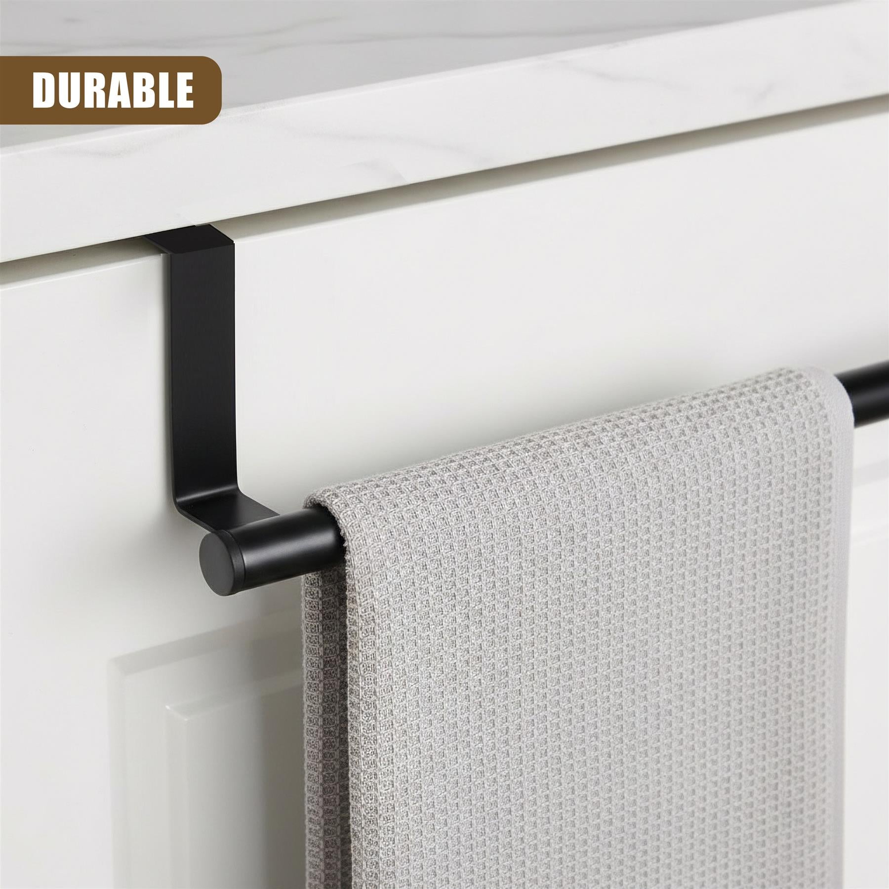 Black metal rail mounted on a white cabinet holds a folded, textured light gray tea towel.