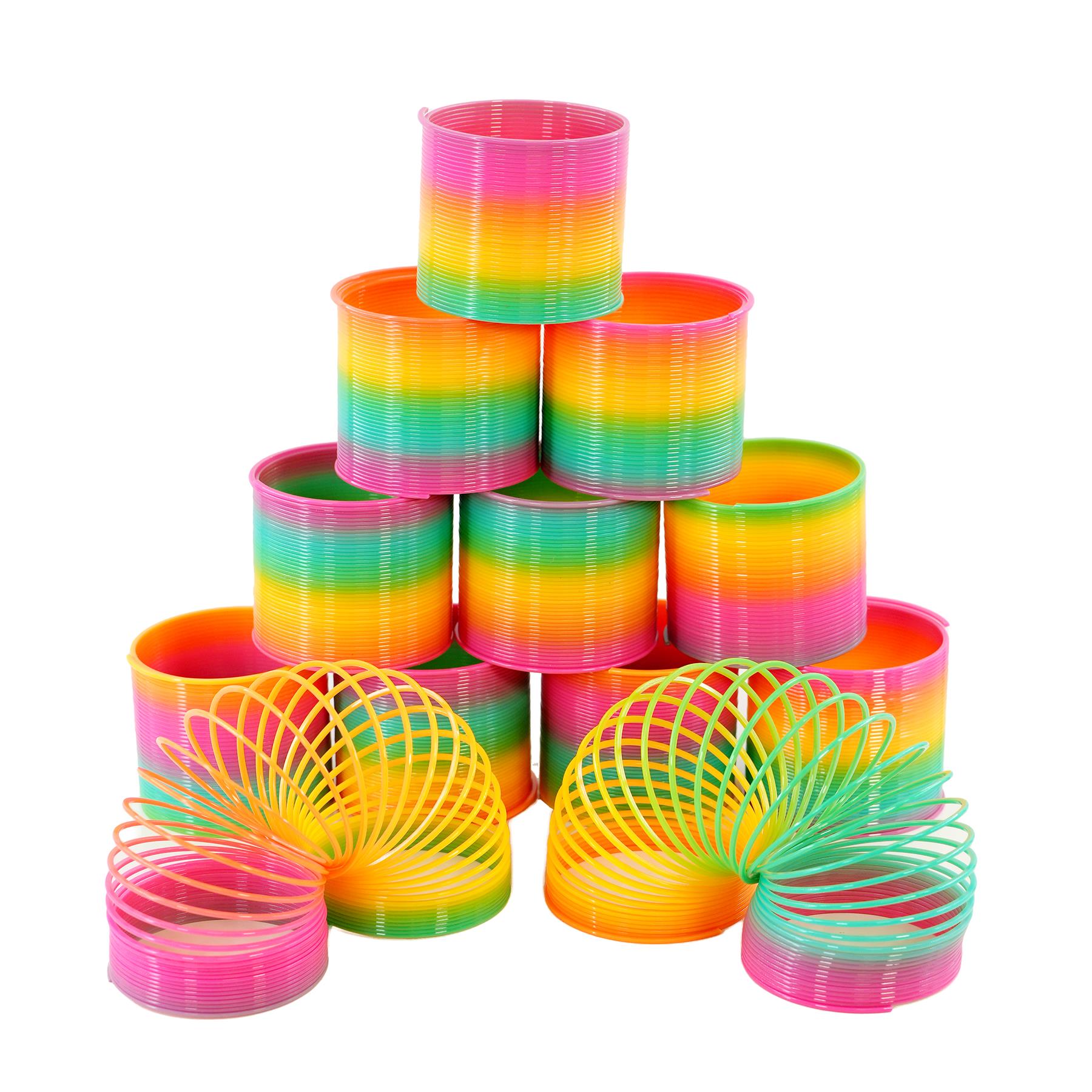 Set of colorful plastic craft items, including stacked rings and open coiled springs in rainbow hues.
