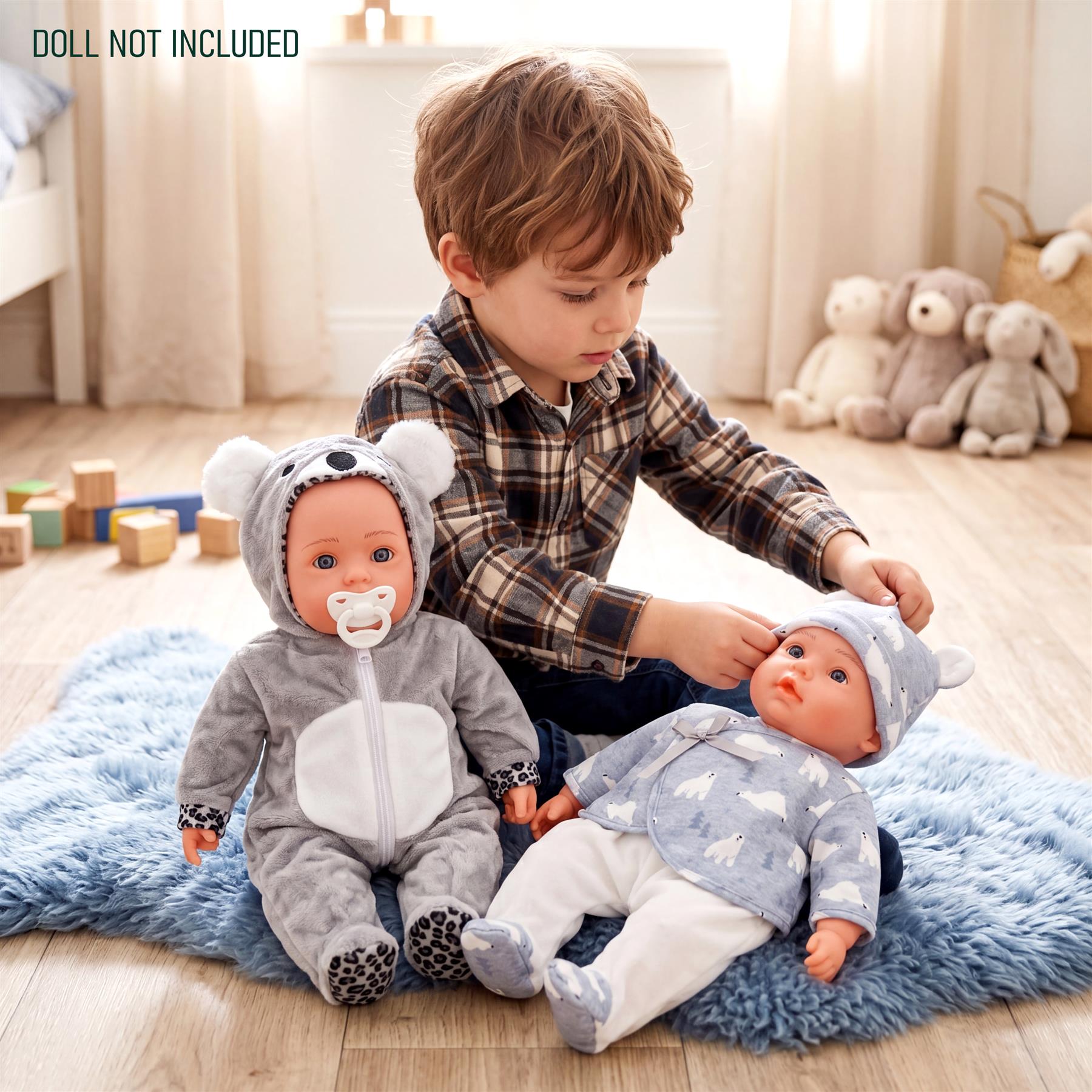 Two stuffed dolls wearing coordinating gray and blue animal print outfits rest on a rug.