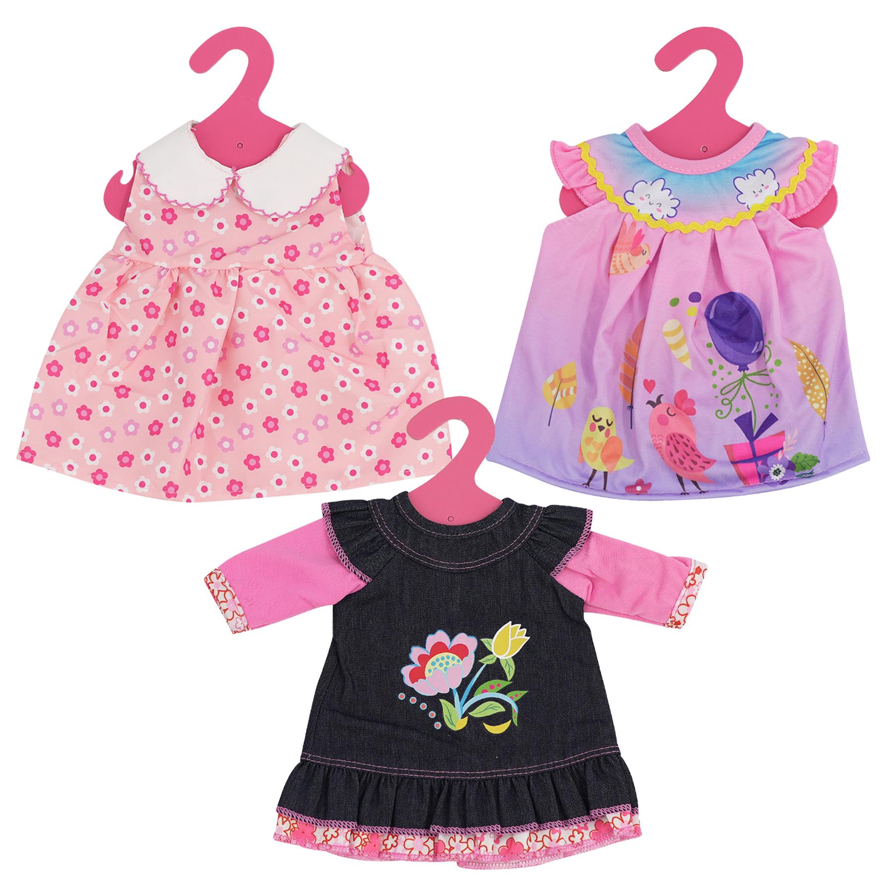 Doll outfits set with six items: 2 pink tops, 2 striped tops, and 2 denim bottoms. Each top has a unique floral or bird embroidery design. The bottoms are plain blue jeans. Set includes two tops in each size, suitable for dolls from 30 to 40 cm tall. The outfits are displayed on hangers with price tags attached to them. The set consists of complete coordinating looks for dress-up play. - The Magic Toy Shop