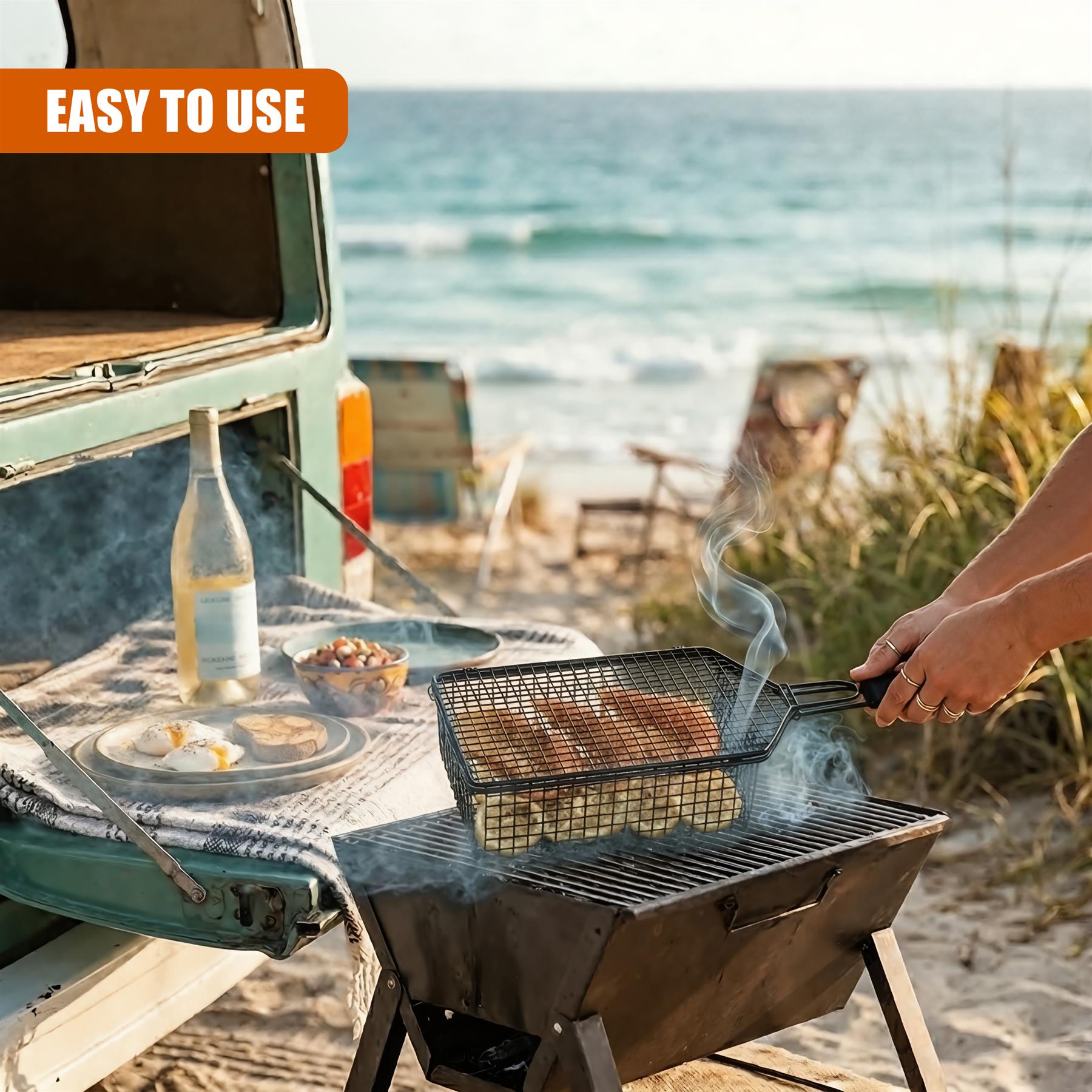 A hand places food into a metal grilling basket situated on an outdoor BBQ grill.